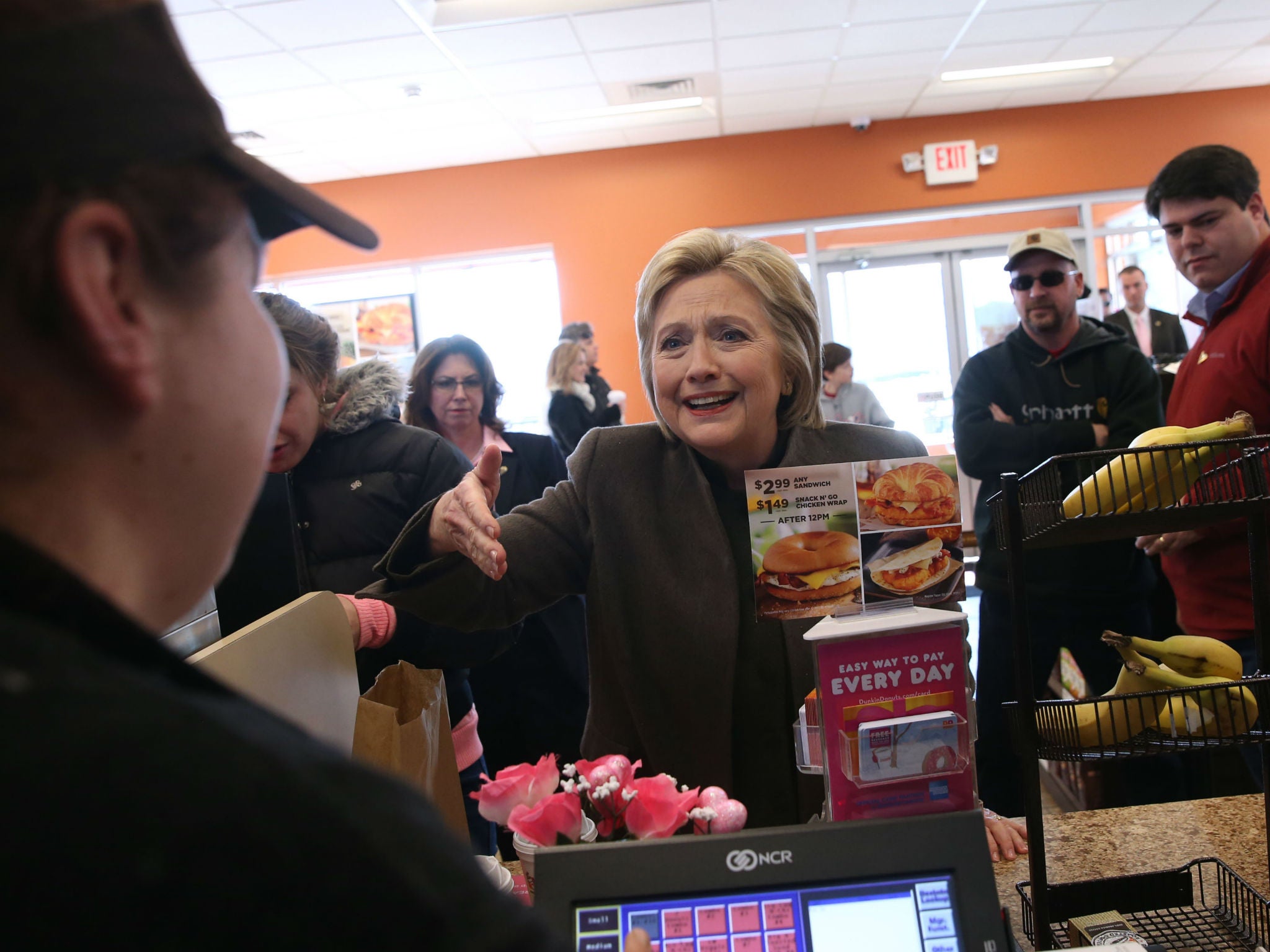 Ms Clinton eats what the people eat - iced coffee and donuts