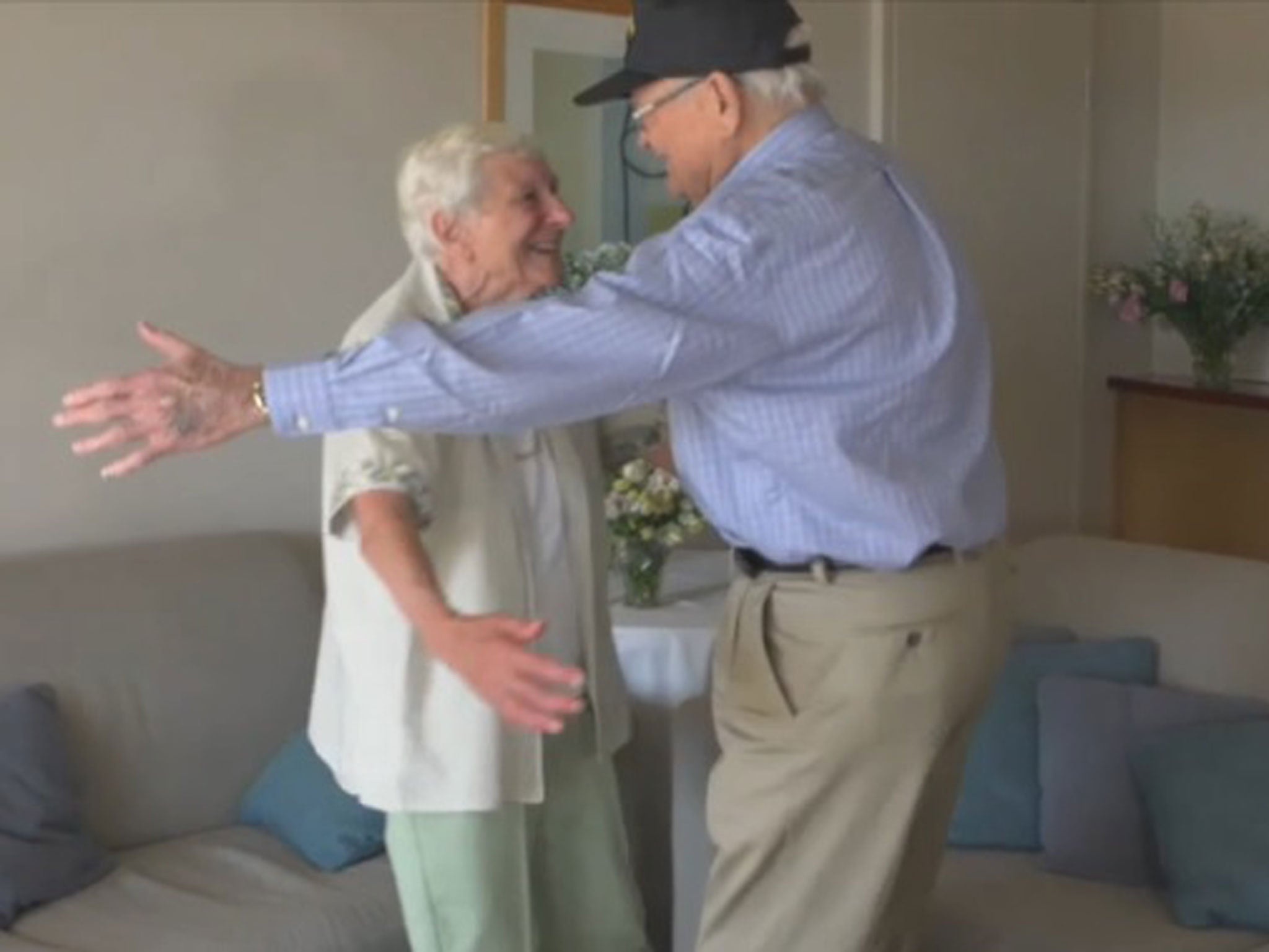 Wartime couple Norwood Thomas, 93, and Joyce Morris, 88, embrace after last seeing each other in 1944