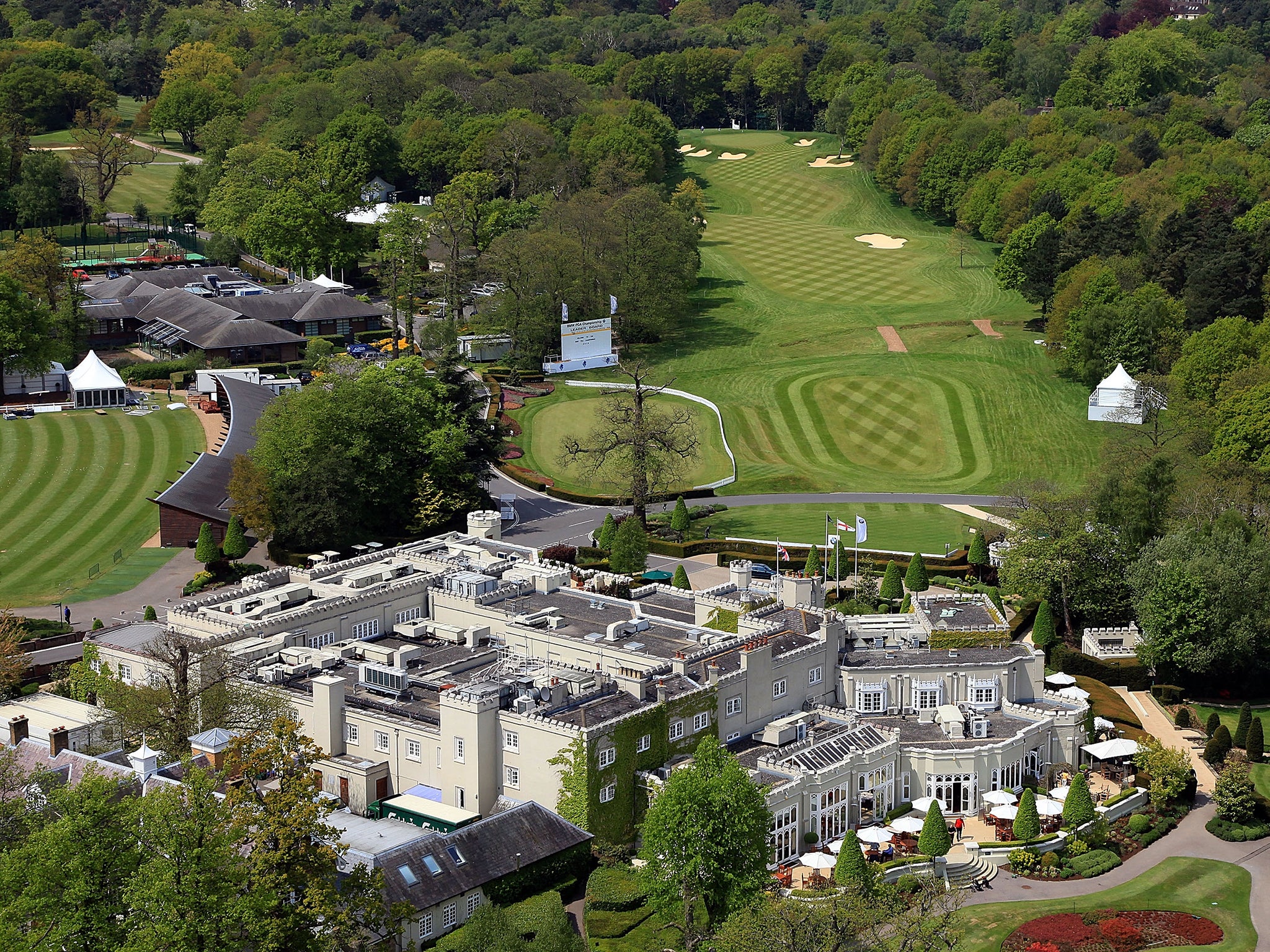 View of the the par 4, 1st hole with the clubhouse complex in the foreground on the recently renovated West Course at the Wentworth Club venue