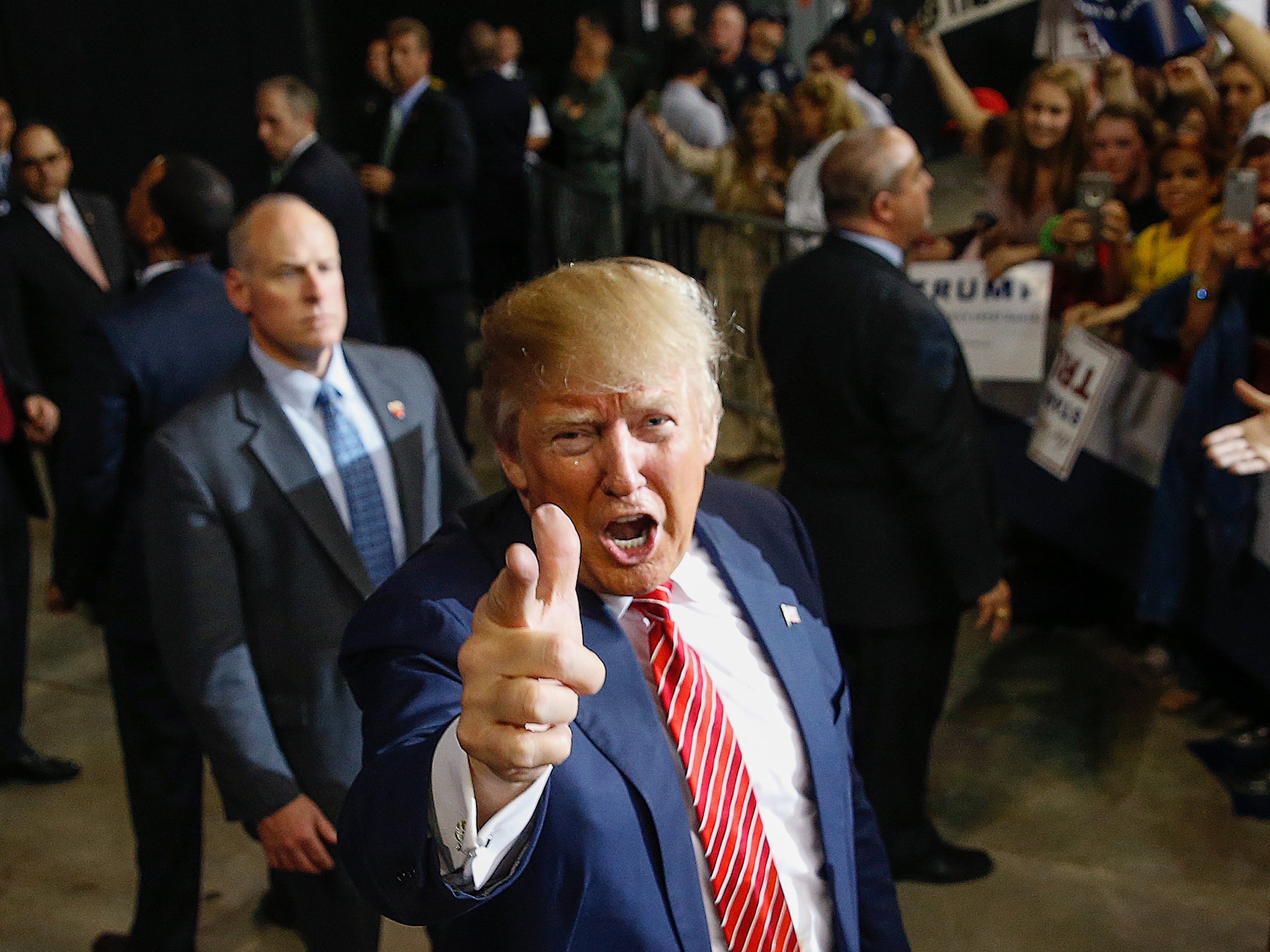 Republican presidential candidate Donald Trump acknowledges photographers after speaking at a campaign rally in Baton Rouge, La.