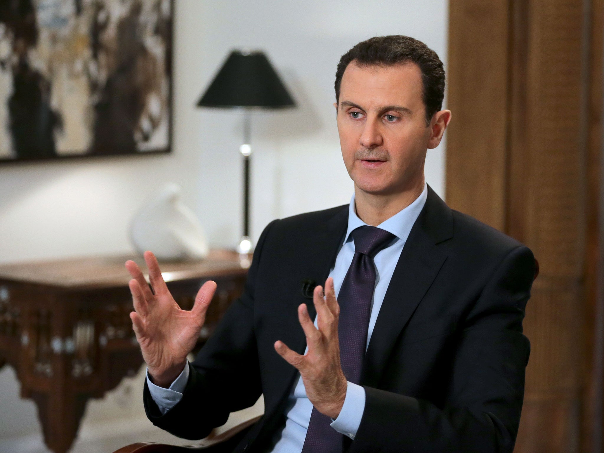 Syrian President Bashar al-Assad during an interview with AFP in the capital Damascus