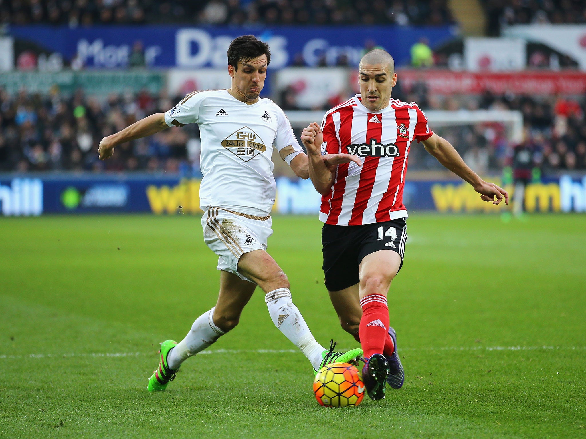 &#13;
Jack Cork and Oriol Romeu compete for the ball&#13;