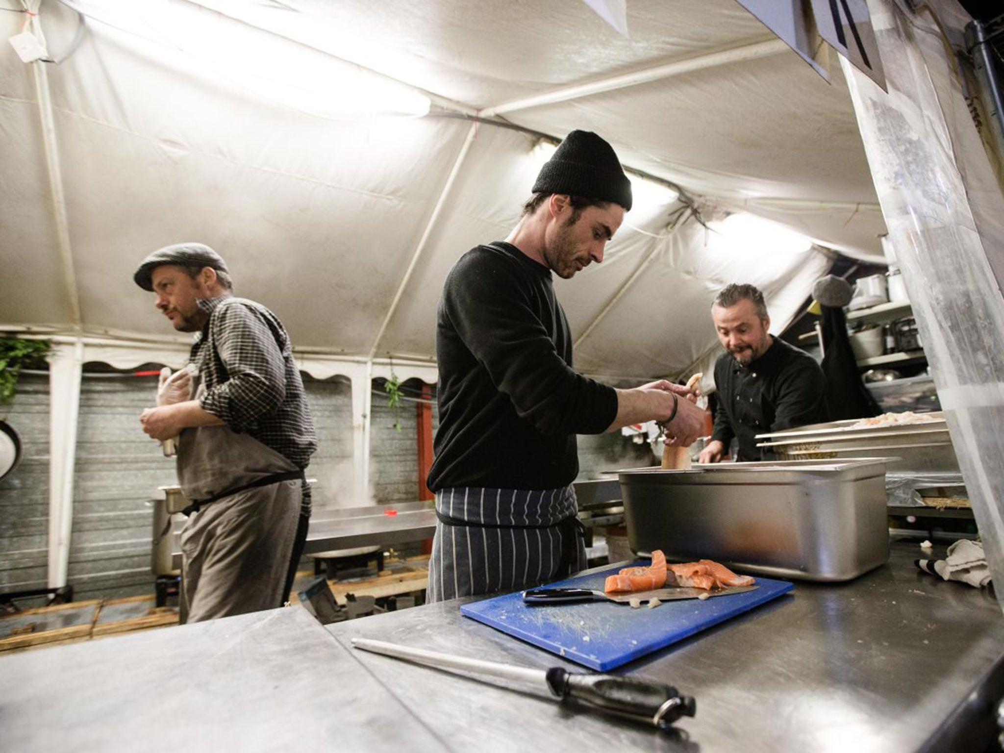 Cooks prepare to feed the refugees