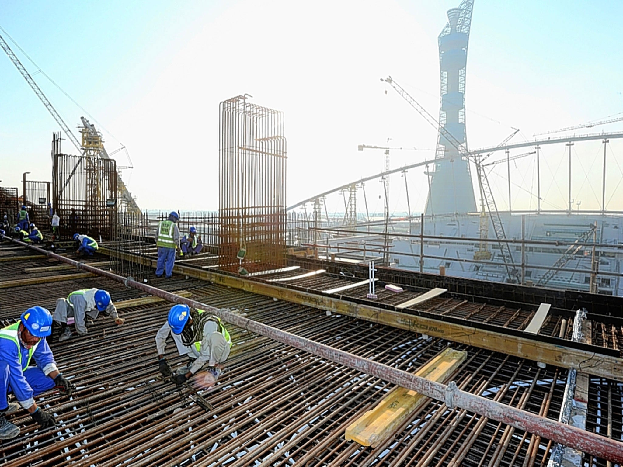 Workers on the Khalifa International Stadium for Qatar’s 2022 World Cup