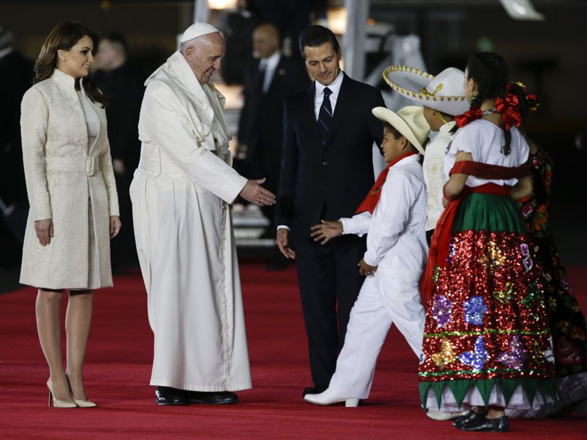 &#13;
Pope Francis, on his arrival at Mexico City, on Friday, with the President of Mexico and his wife &#13;