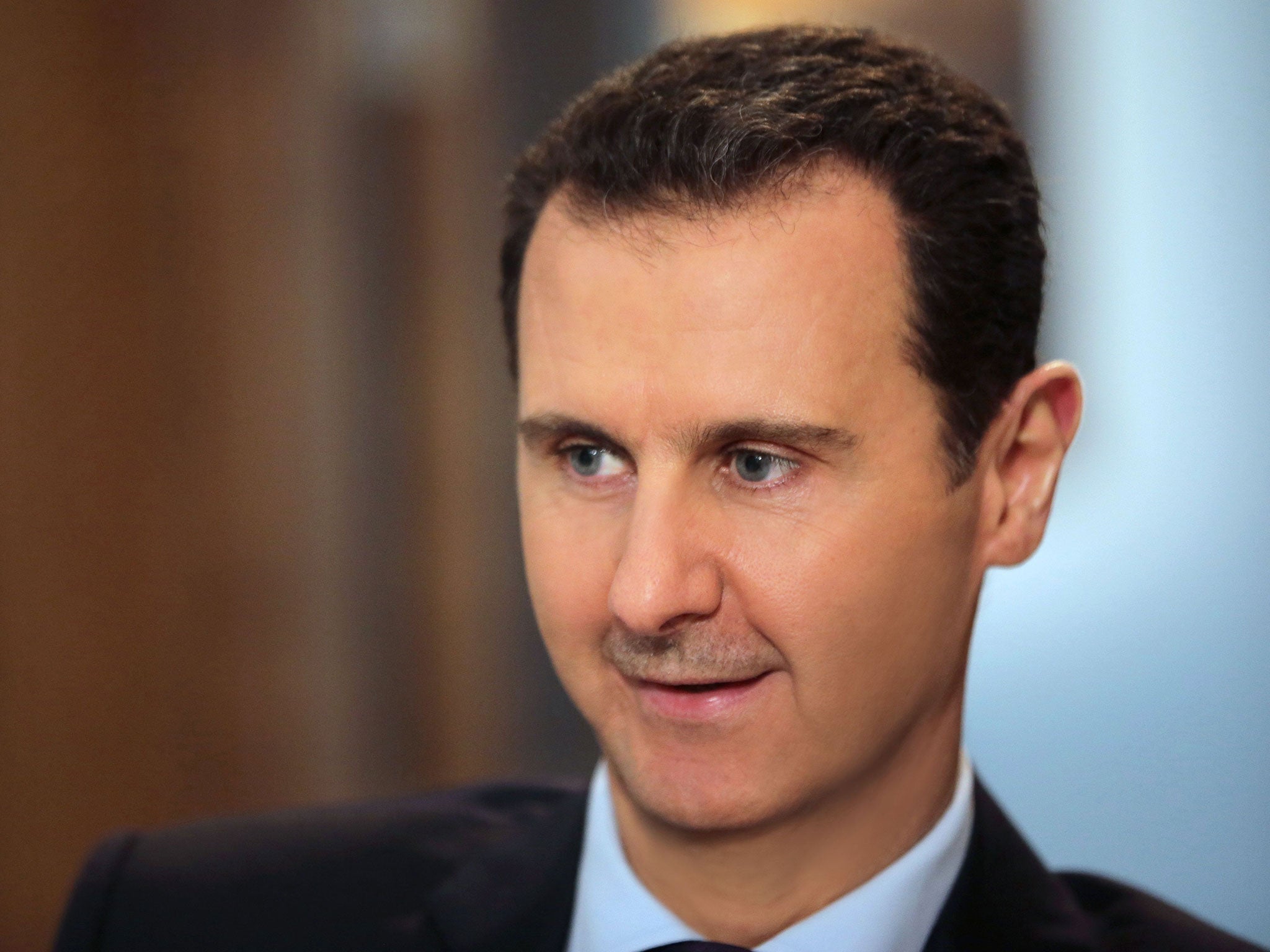 'What's important is how I think. Certainly, and self-evidently, I will seek, and that is what I am doing now, to protect Syria, not to protect the chair I'm sitting on,' Syrian President Bashar al-Assad said