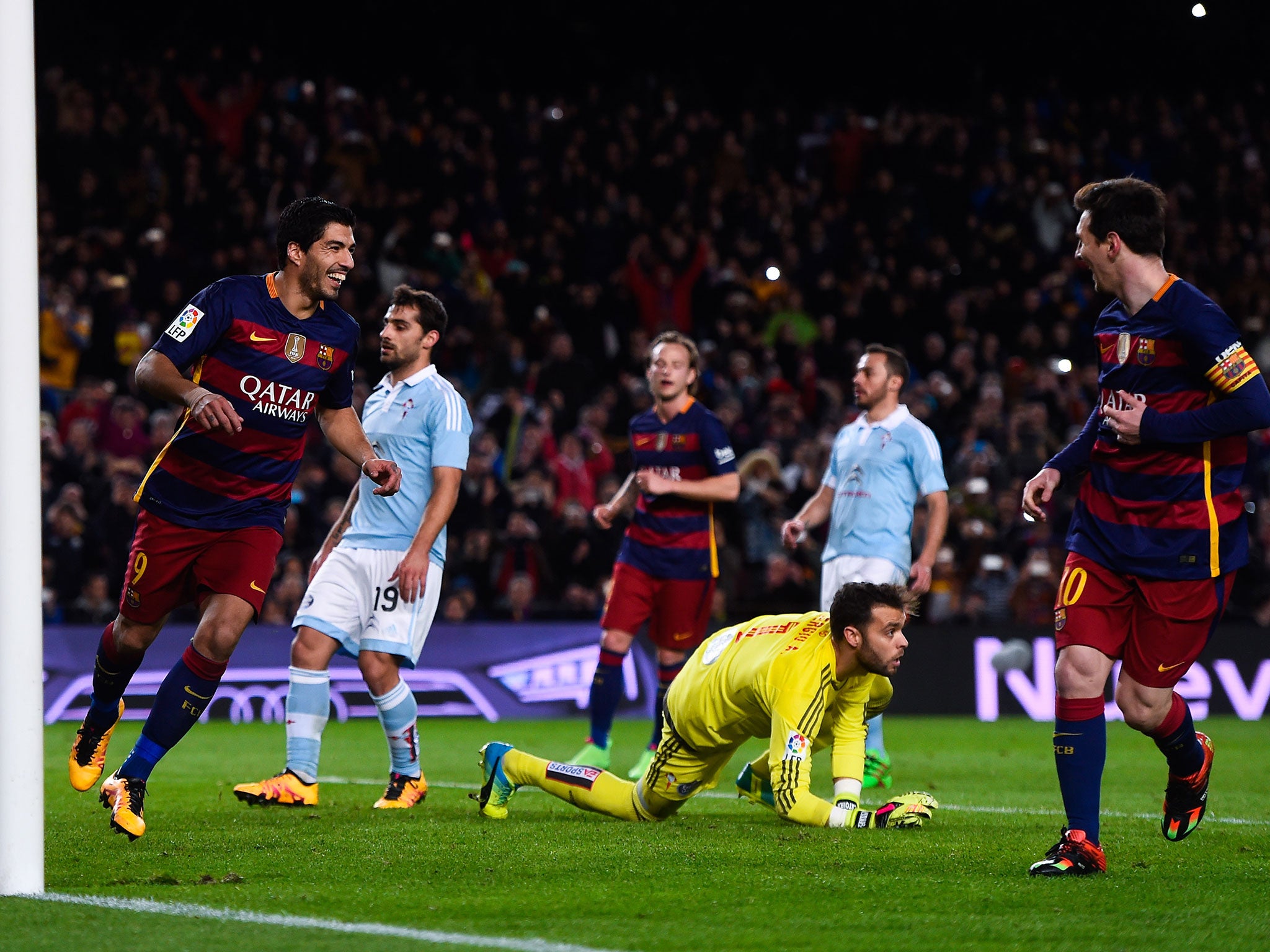 Suarez and Messi celebrate after combining to score from a penalty in the 6-1 win