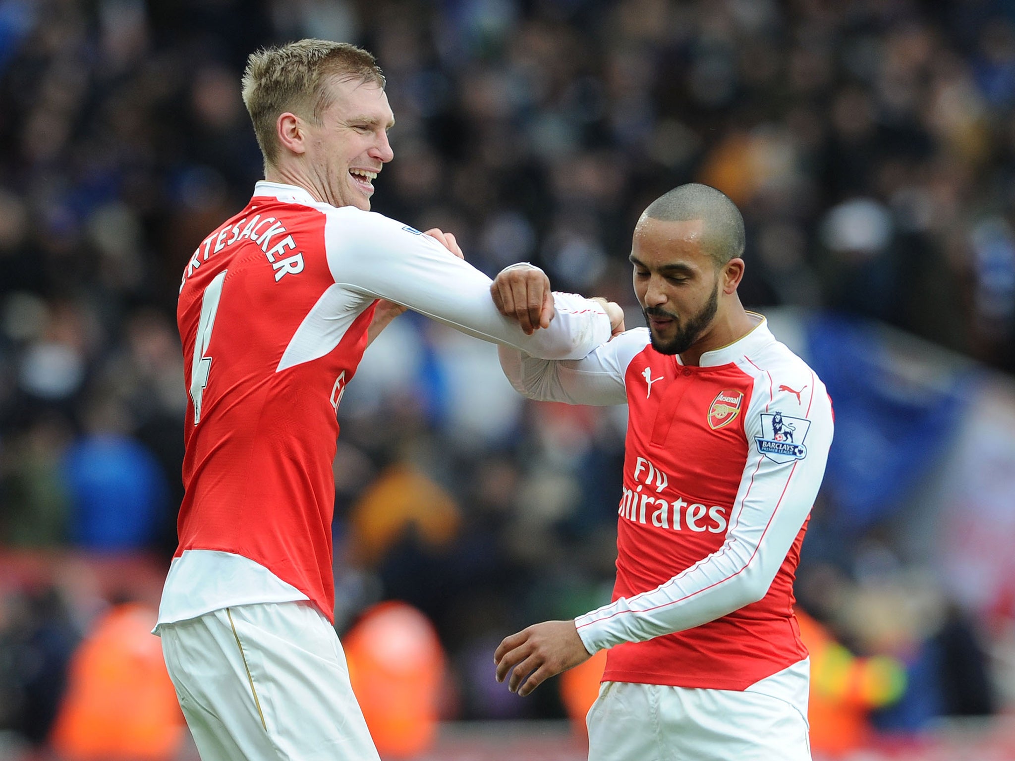 Arsenal's Per Mertesacker and Theo Walcott