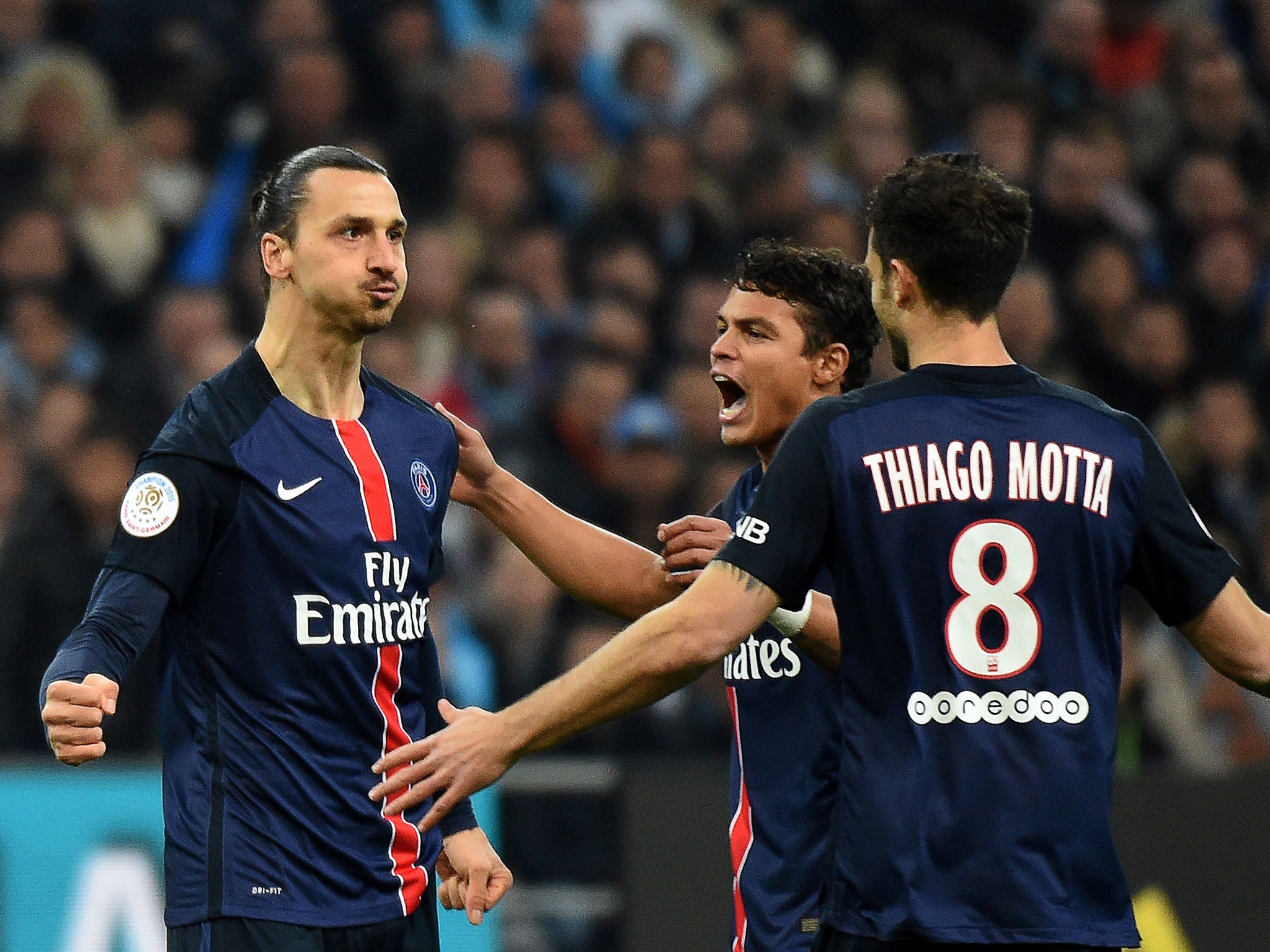 Zlatan Ibrahimovic celebrates with Thiago Silva and Thiago Motta