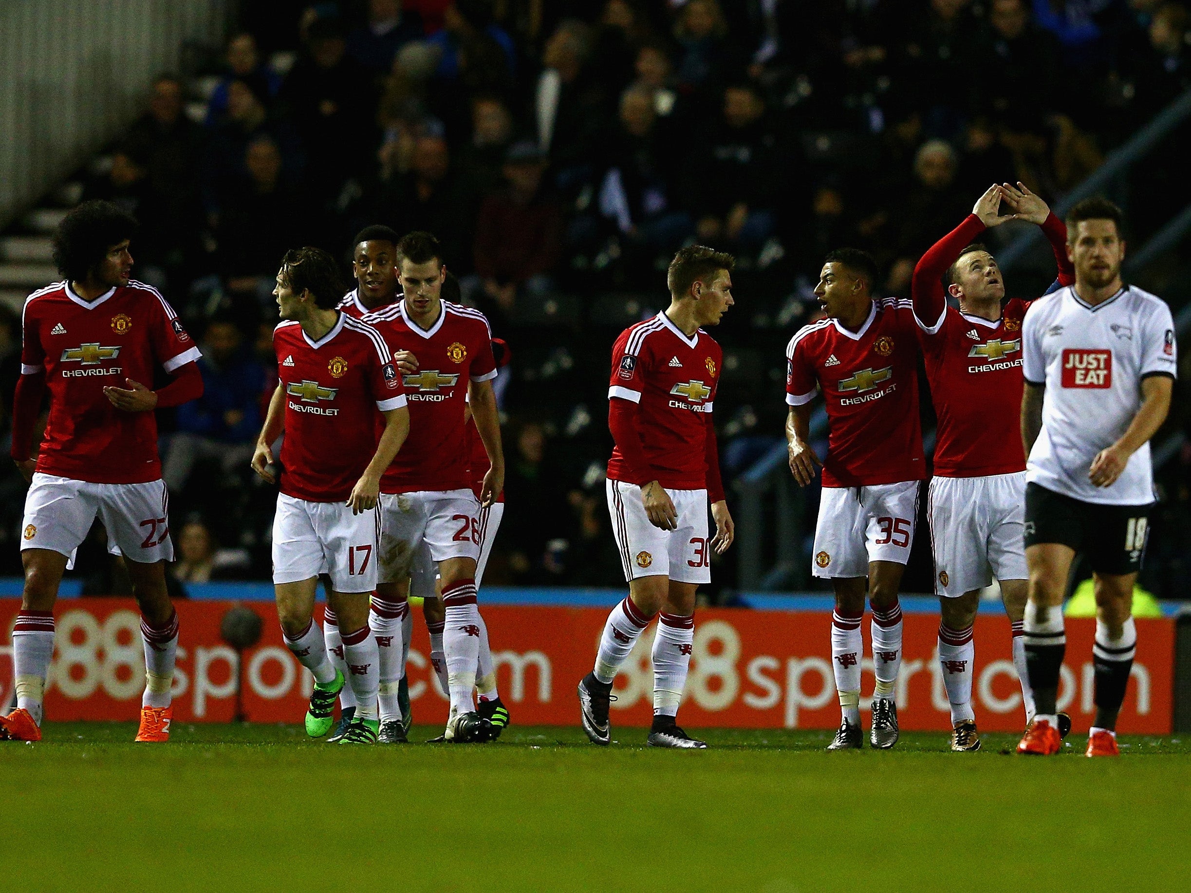 Wayne Rooney celebrates during the win against Derby County