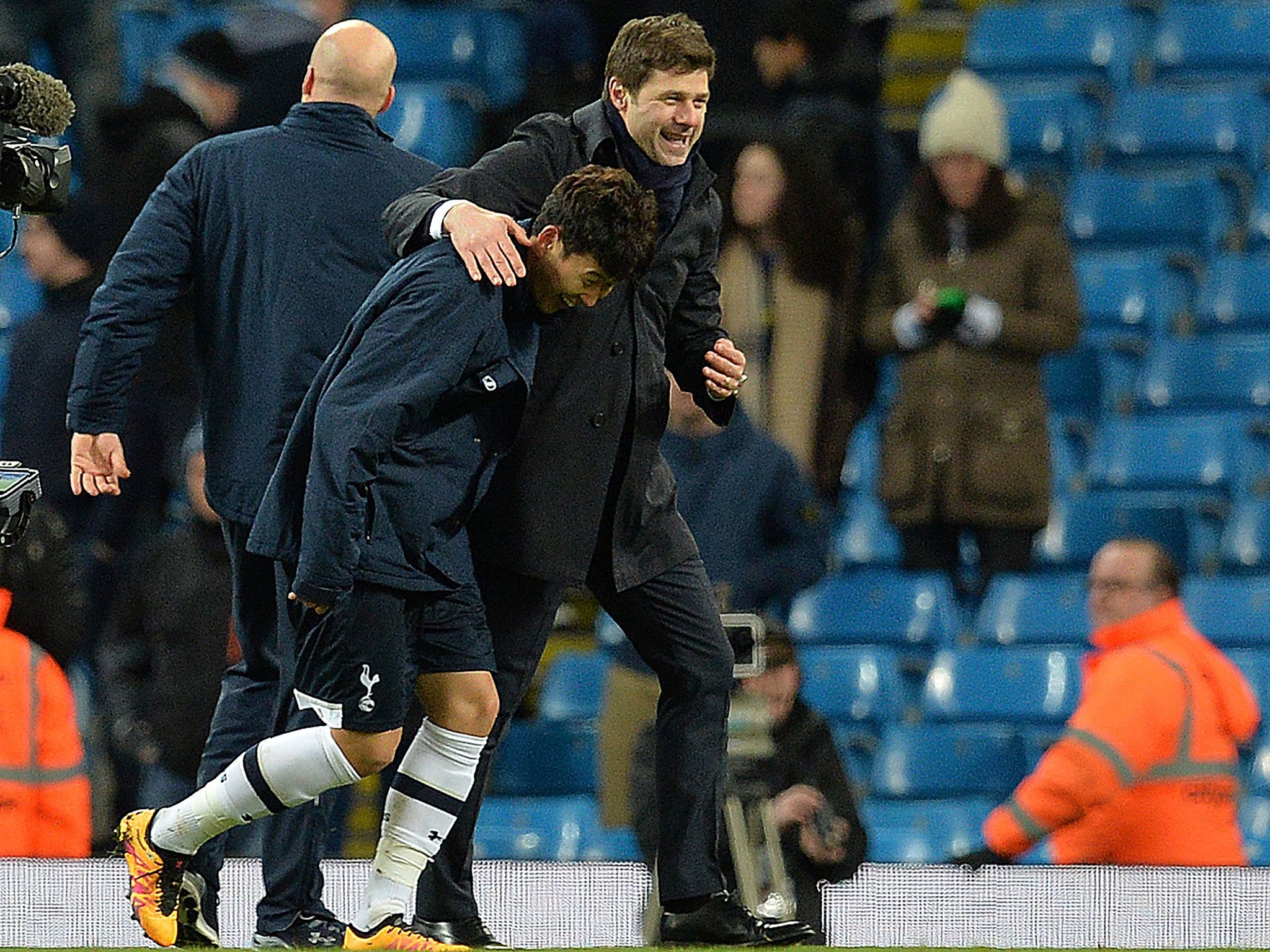 Mauricio Pochettino celebrates the 3-1 win over Manchester City with Son Hueng-min