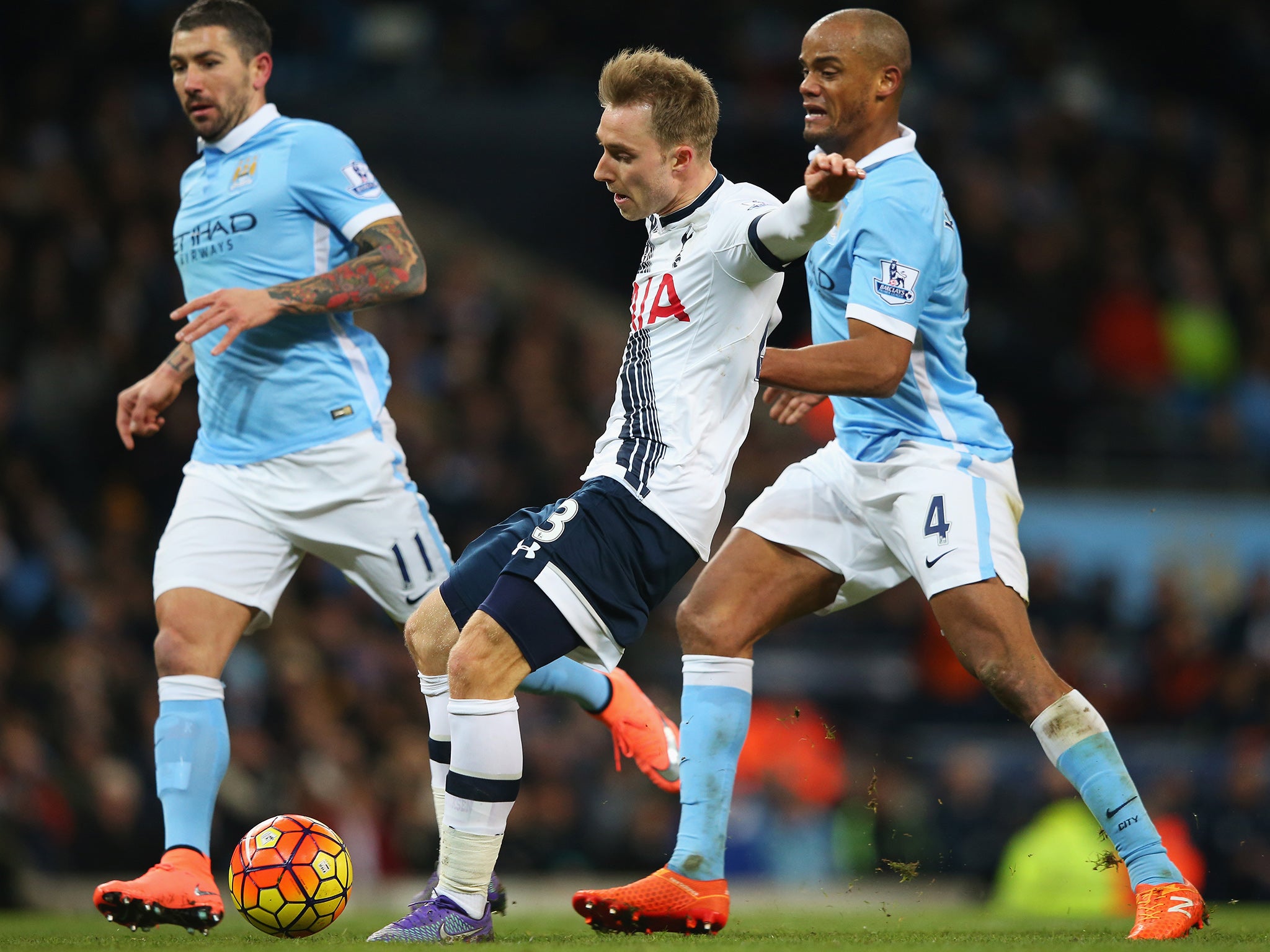 Christian Eriksen plays a pass against Manchester City