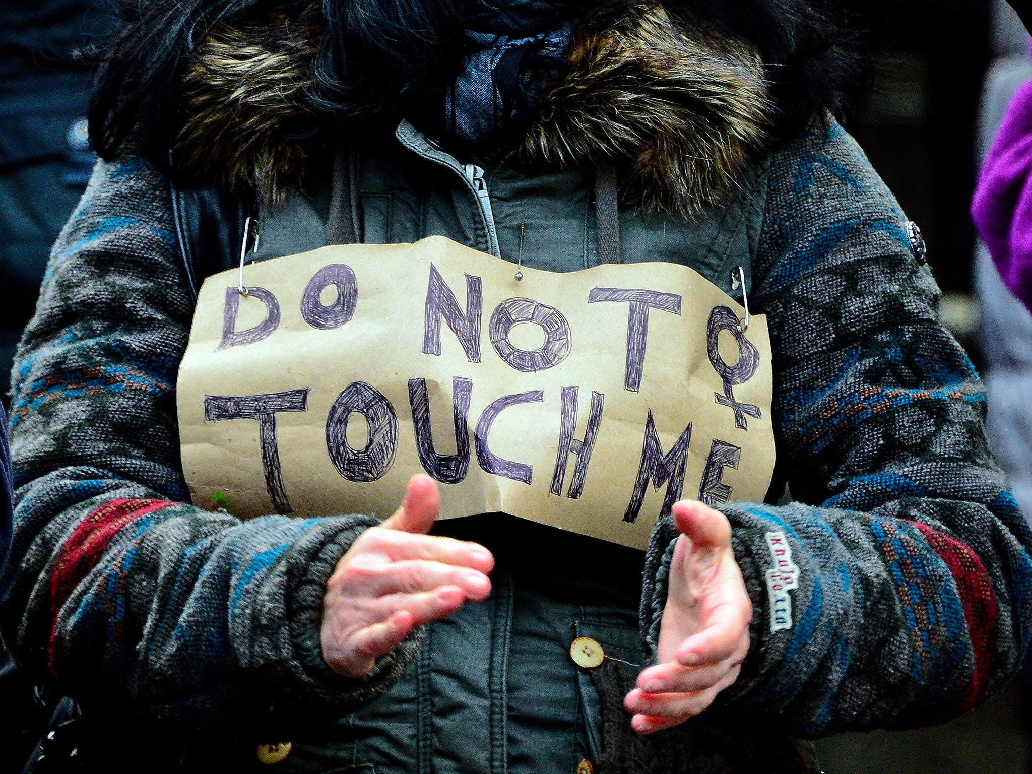 A woman protests in front of Hauptbahnhof main railway station against the New Year's Eve sex attacks on 9 January, 2016, in Cologne, Germany