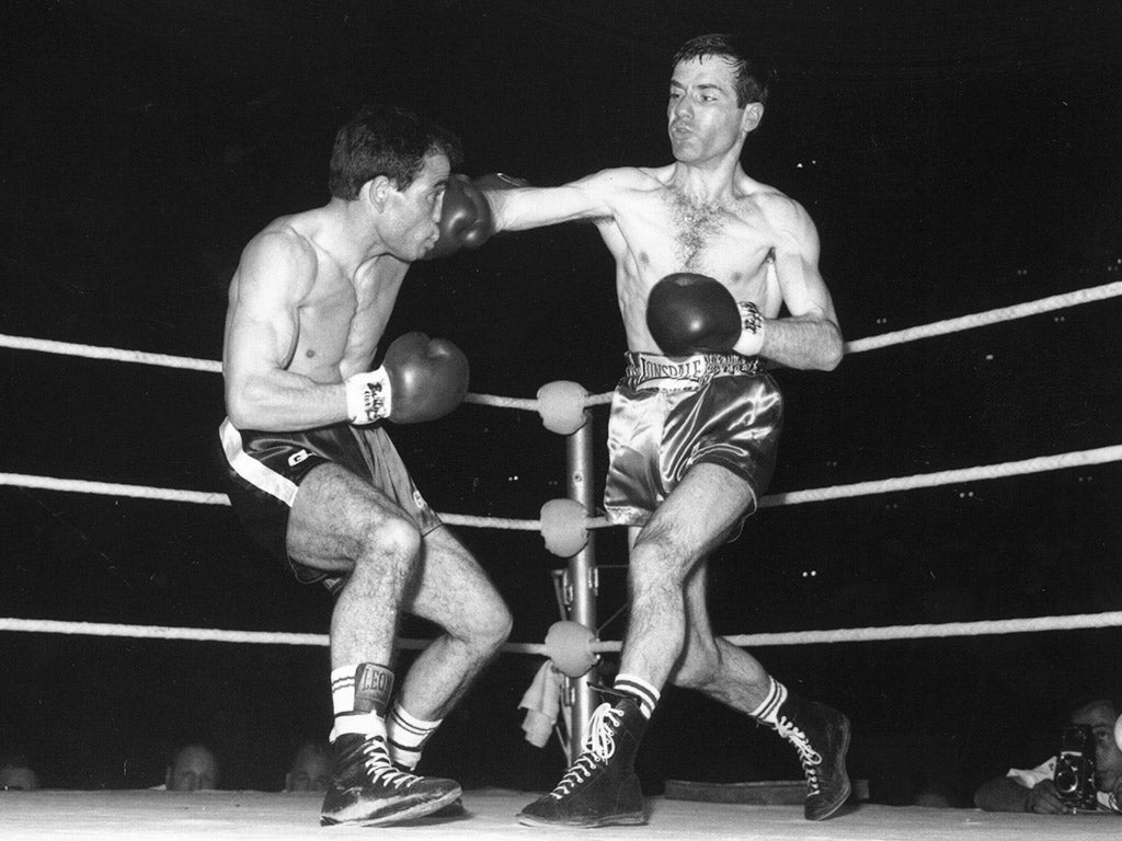 Walter McGowan lands a right hand on Salvatore Burruni en route to winning the world flyweight title at Wembley in 1966