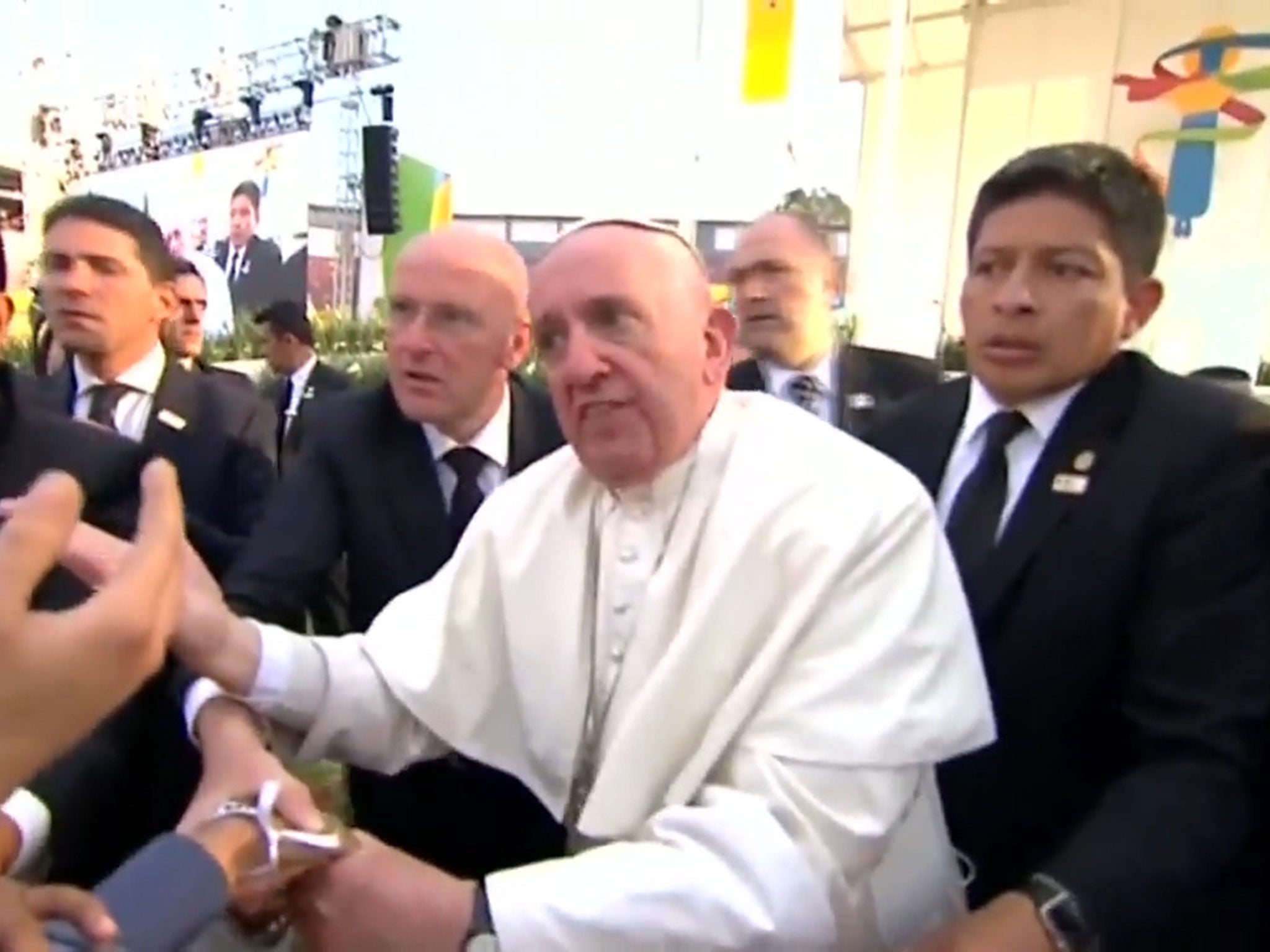 Screengrab from a video showing Pope Francis angrily rebuking members of the crowd who almost pulled him to the ground