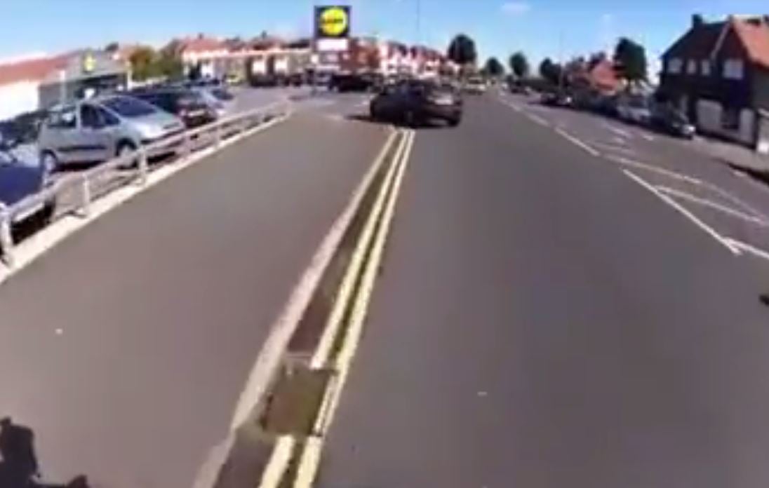 The cyclist said the woman in the car (pictured above) had cut across his path to turn into the car park