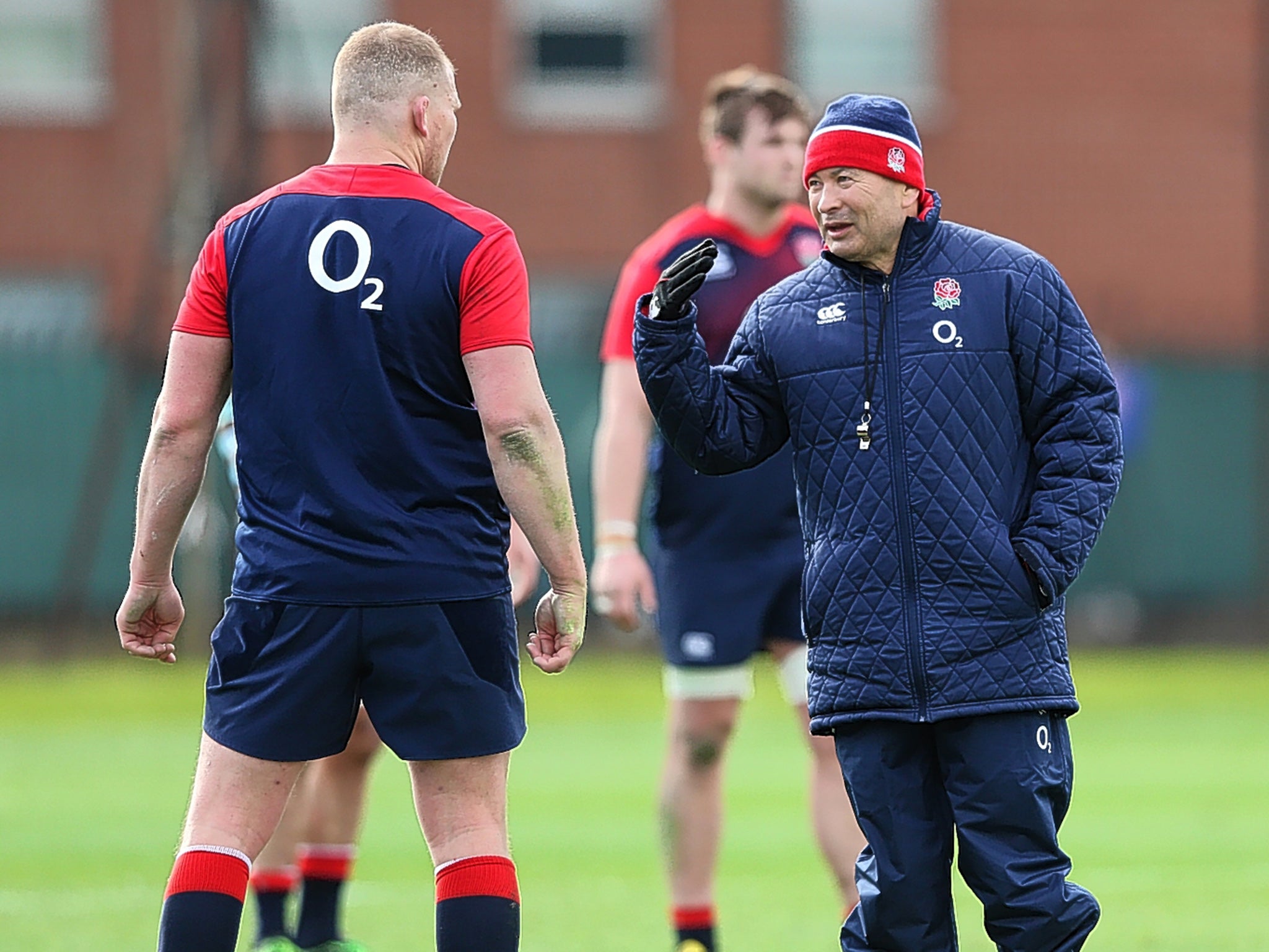 England coach Eddie Jones talks with captain Dylan Hartley