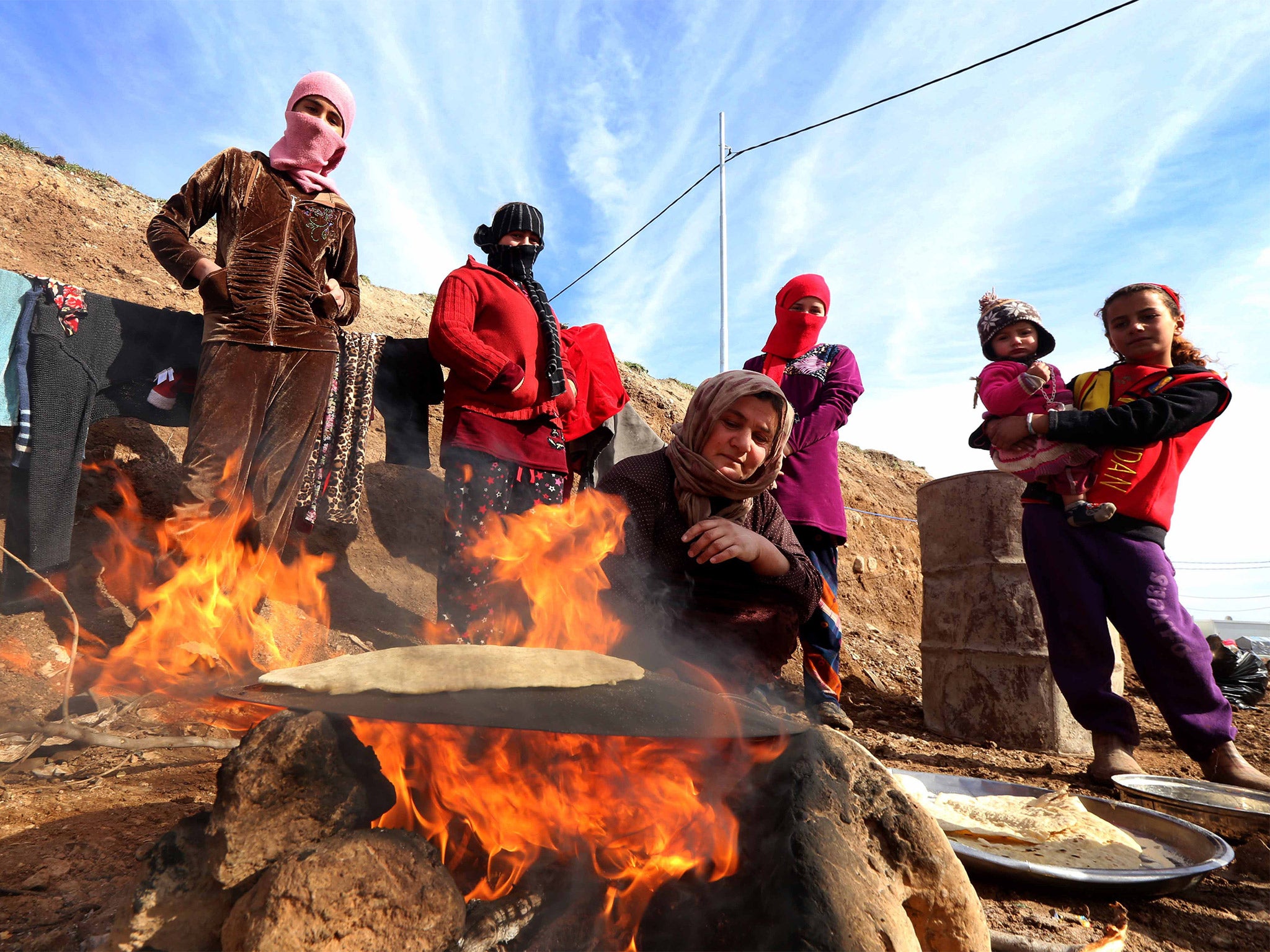 Most of the Yazidis still being held by Isis are reported to be in Syria. If they can be freed they are smuggled across the front line to camps in Kurdish-controlled Iraq