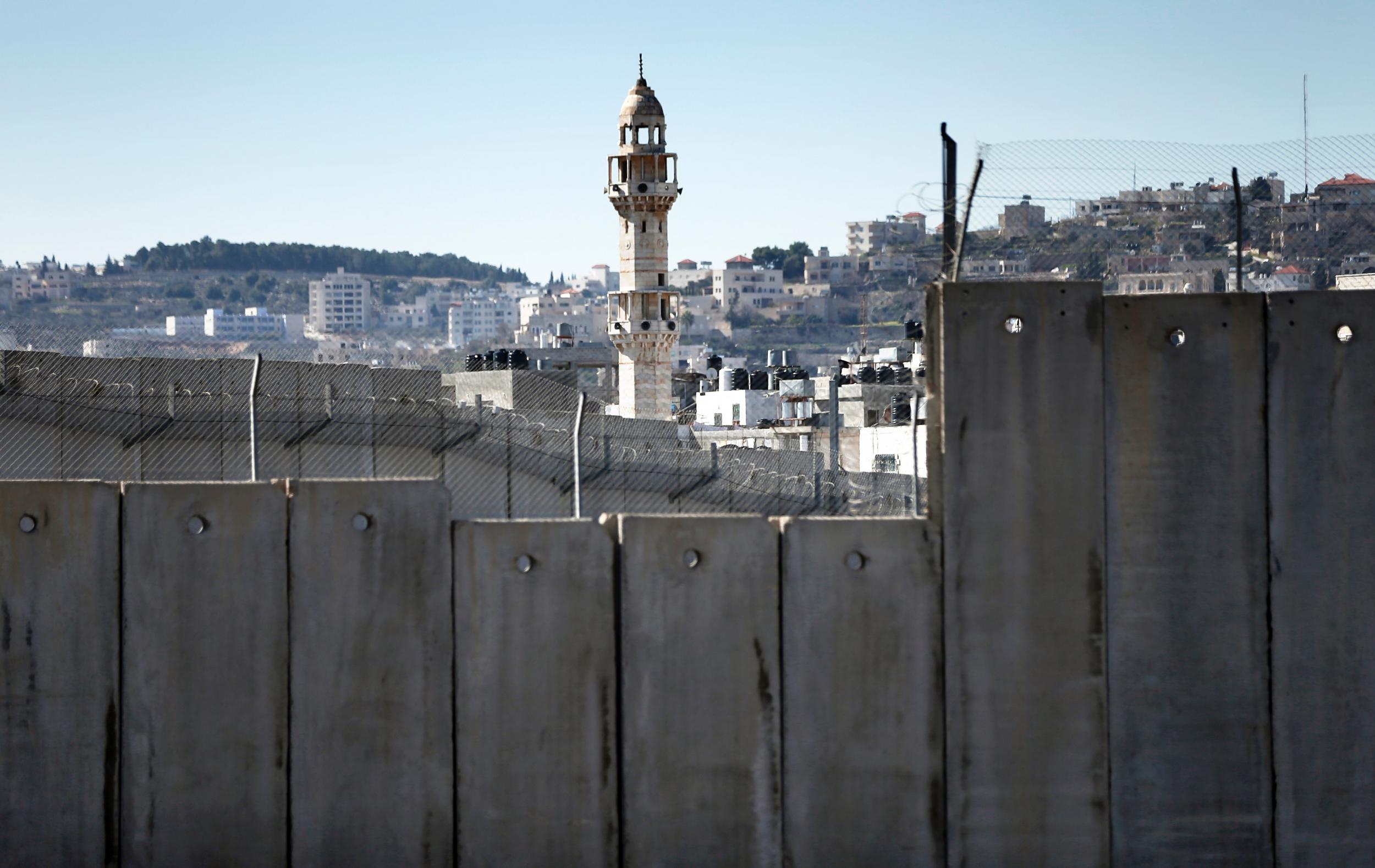 Israel's controversial separation barrier dividing Jerusalem and the West Bank town of Bethlehem, on February 12, 2016