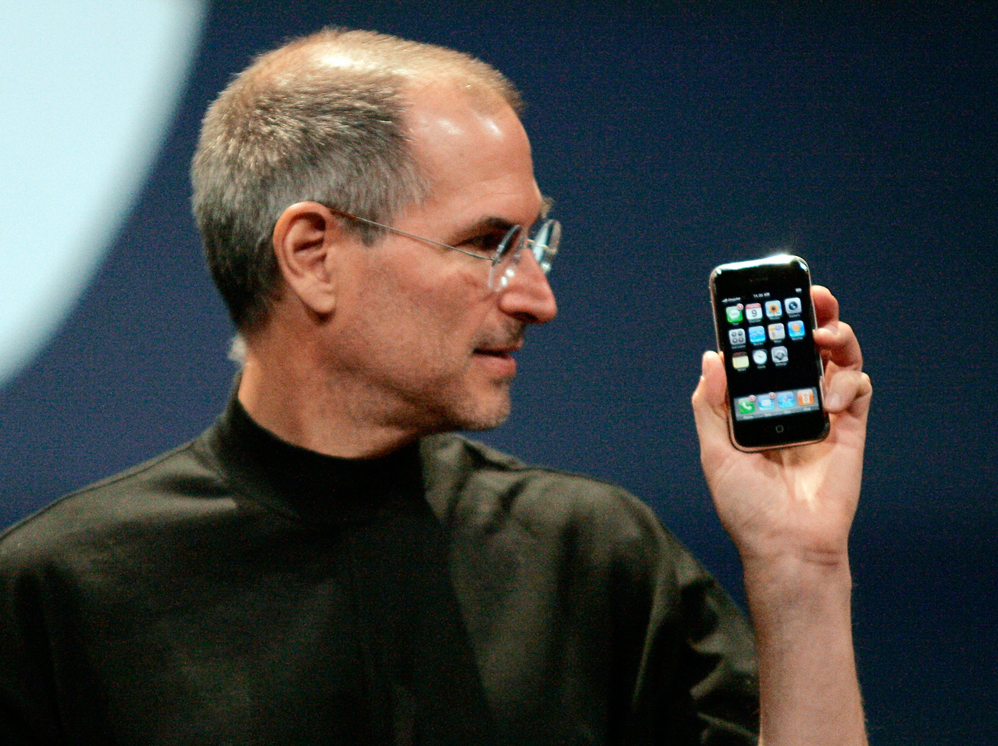 Apple Computer Inc. Chief Executive Officer Steve Jobs holds the new iPhone in San Francisco, California January 9, 2007