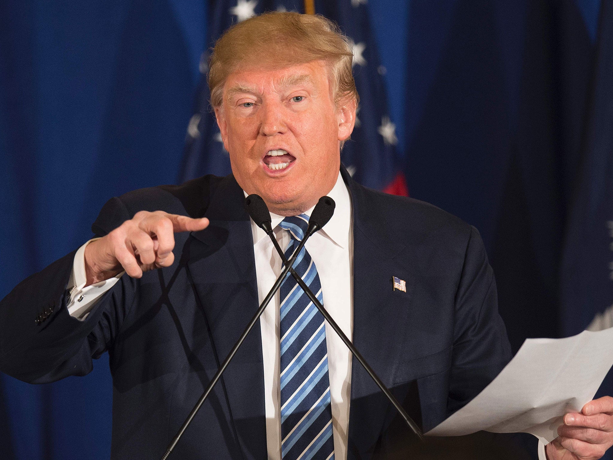 Republican presidential candidate Donald Trump reads from a statement about Pope Francis during a campaign rally in Kiawah, South Carolina