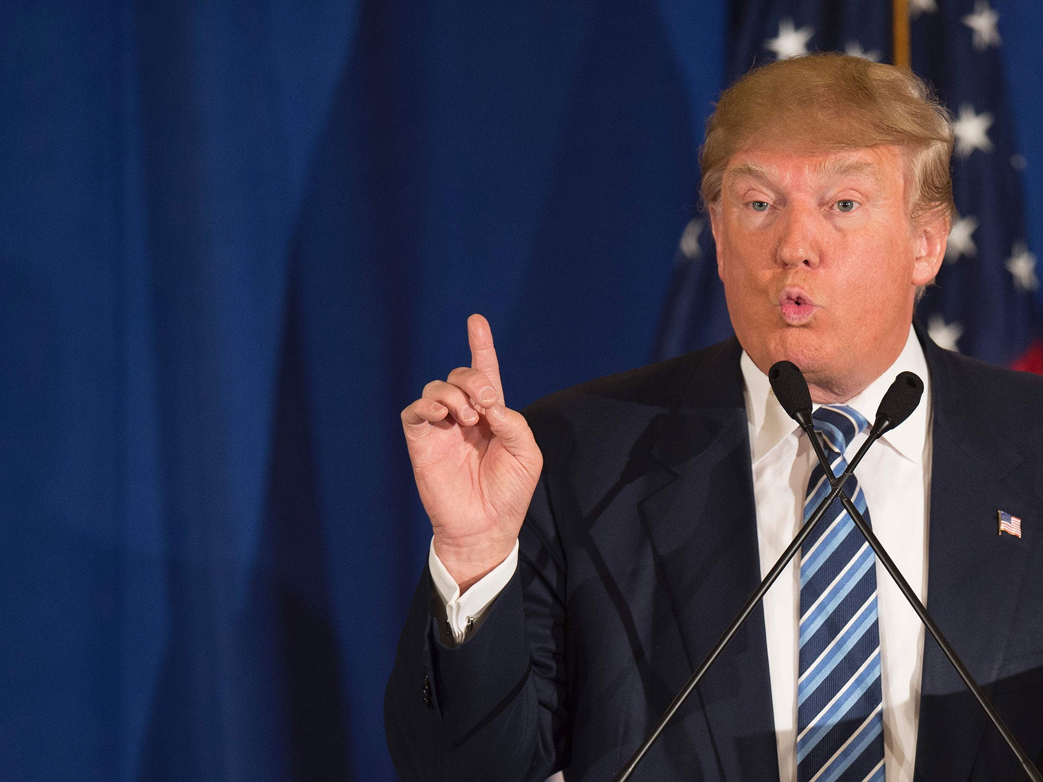 Republican presidential candidate Donald Trump reads from a statement about Pope Francis during a campaign rally in Kiawah, South Carolina