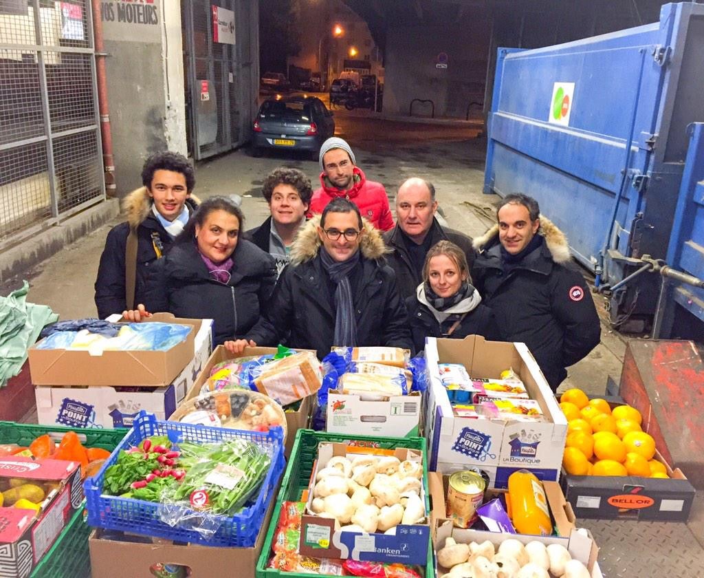 French politician and anti-waste campaigner, Arash Derambarsh, alongside other volunteers donating unsold food to the homeless