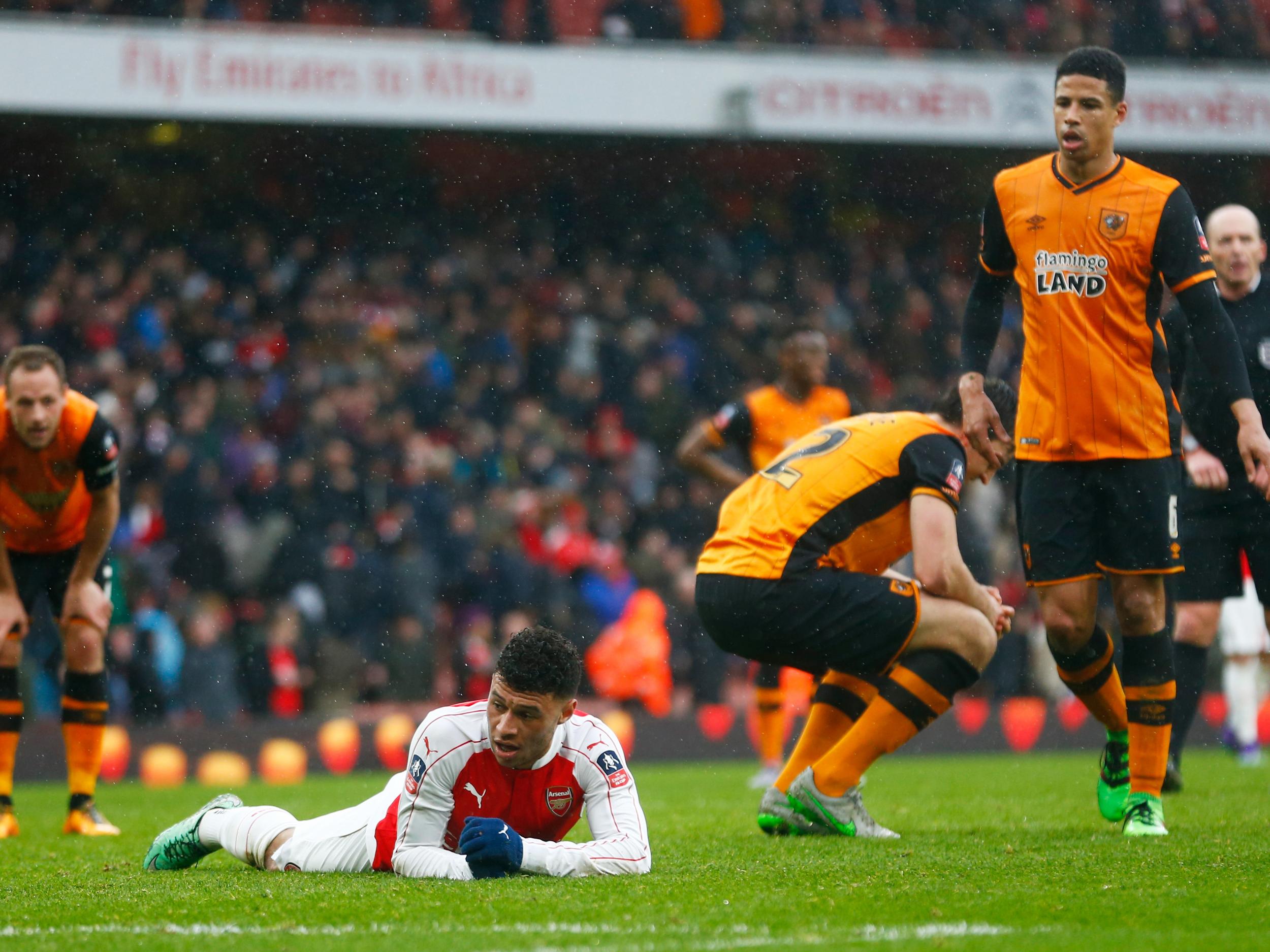 Alex Oxlade-Chamberlain looks on in dismay