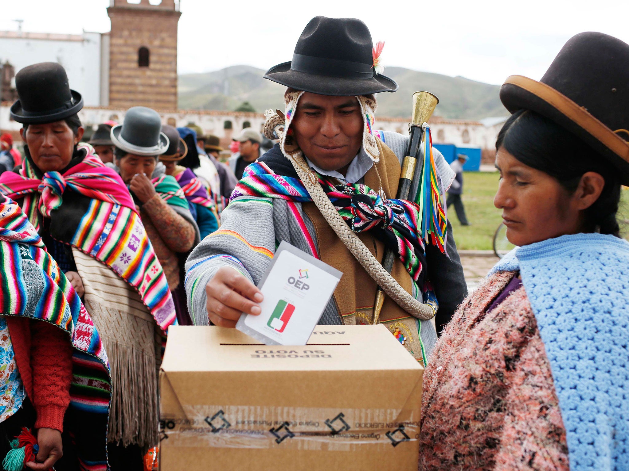 An Aymara Indian casts his ballot at a voting station in Jesus de Machaca, Bolivia