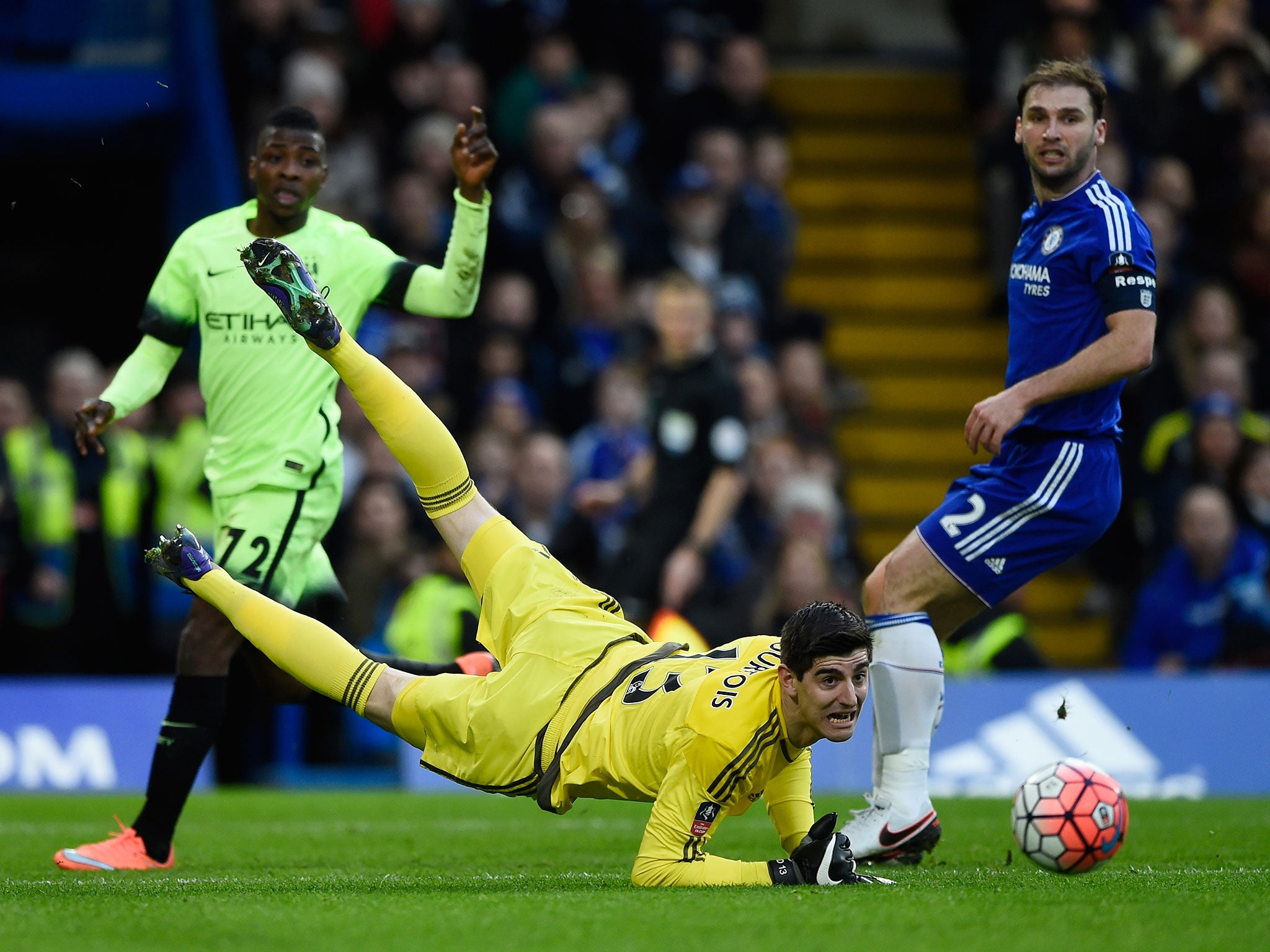 The Chelsea goalkeeper, Thibaut Courtois, makes a save from Manchester City’s young striker Kelechi Iheanacho