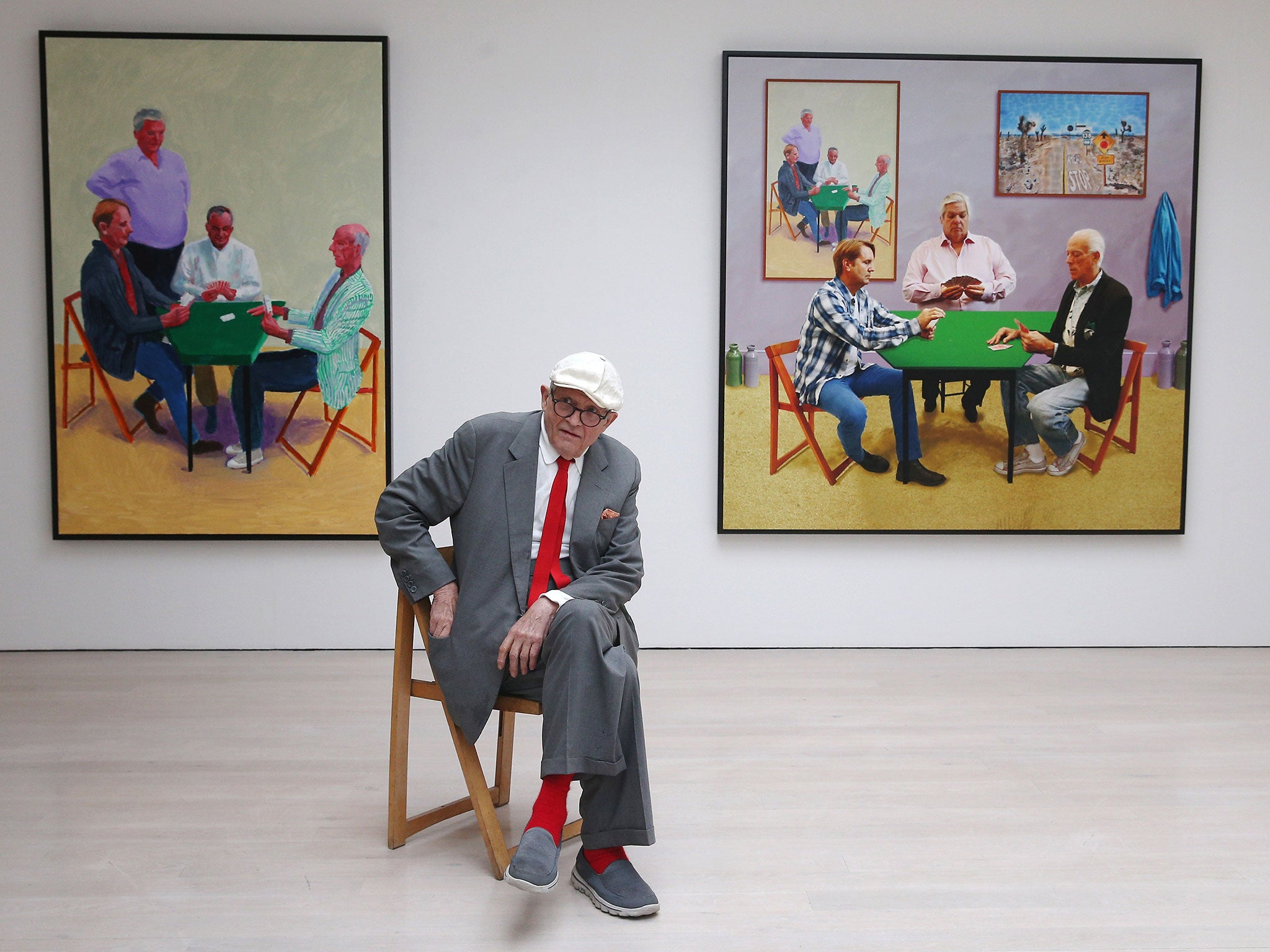 David Hockney with ‘Card Player #3’, left, and ‘Bigger Card Players’ at an exhibition in 2015