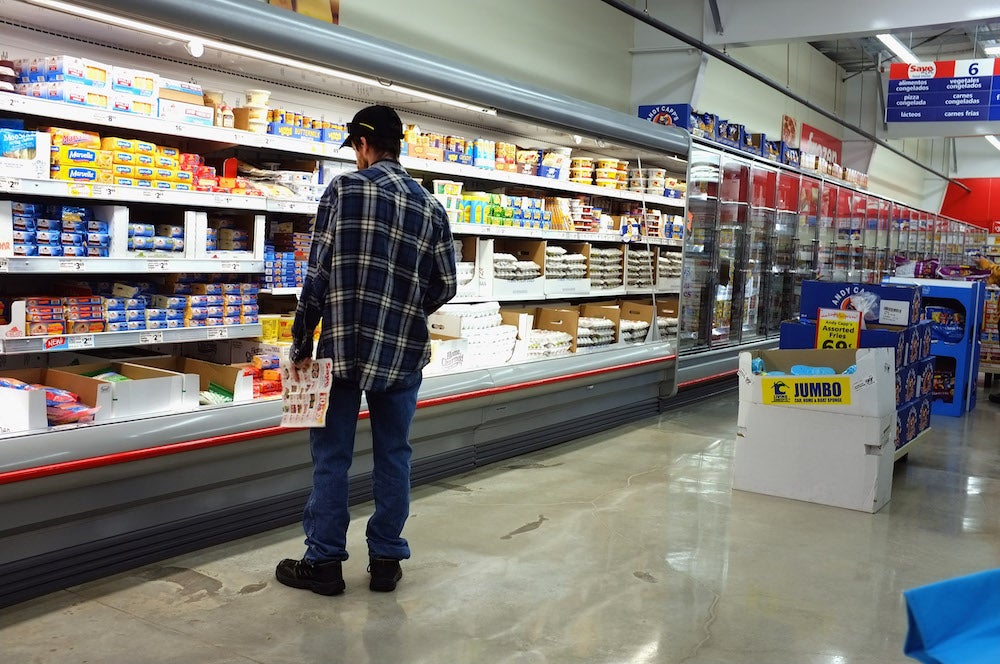 A man buys groceries.