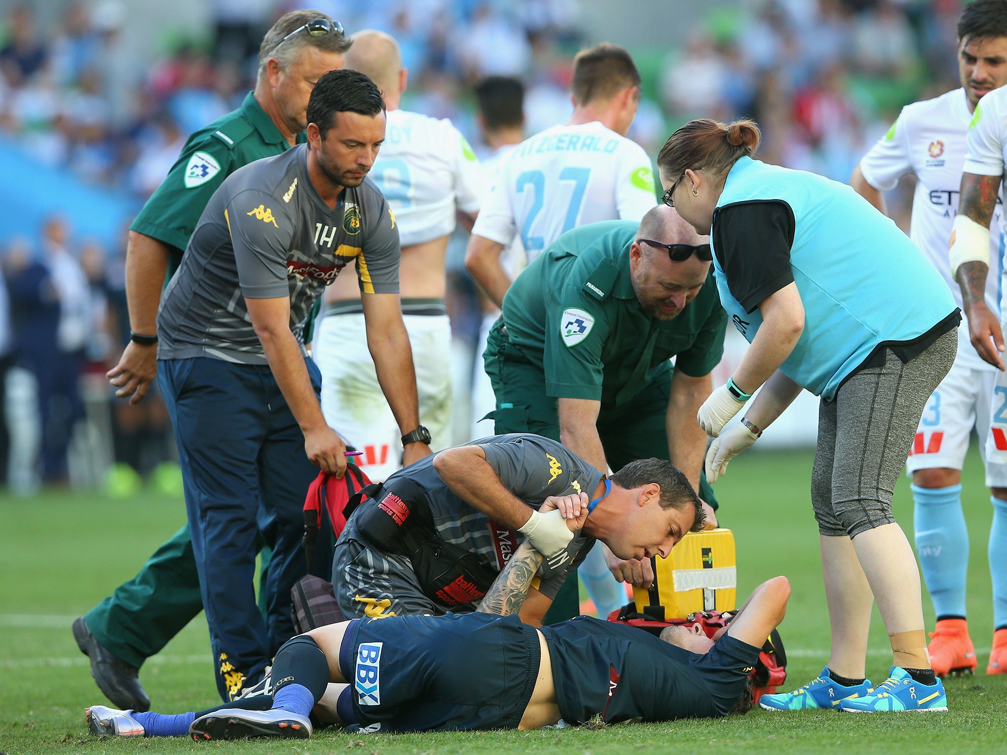 Central Coast Mariners defender Storm Roux receives treatment