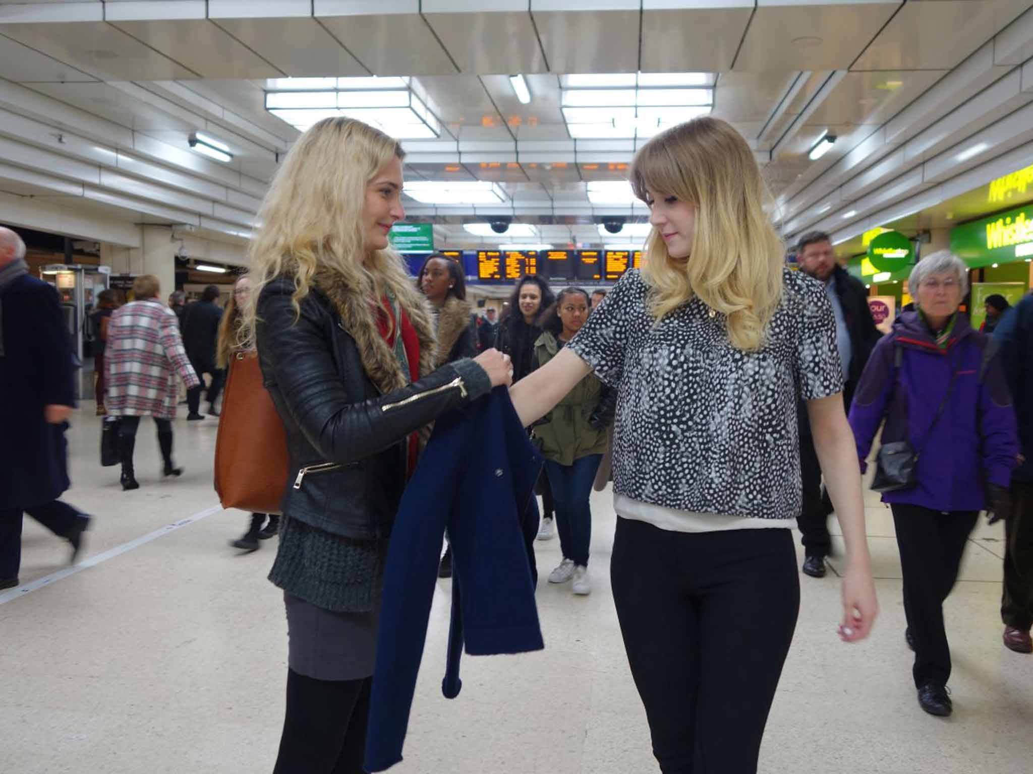 Sizing it up: Chloe Hamilton tries on a jacket from Chana Thorpe while testing out the ShareWear initiative that was created to promote sustainable fashion