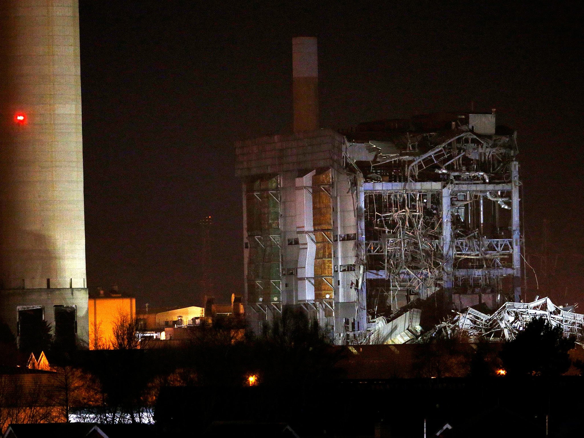 &#13;
Emergency services work under floodlights as they search for survivors at the power station &#13;