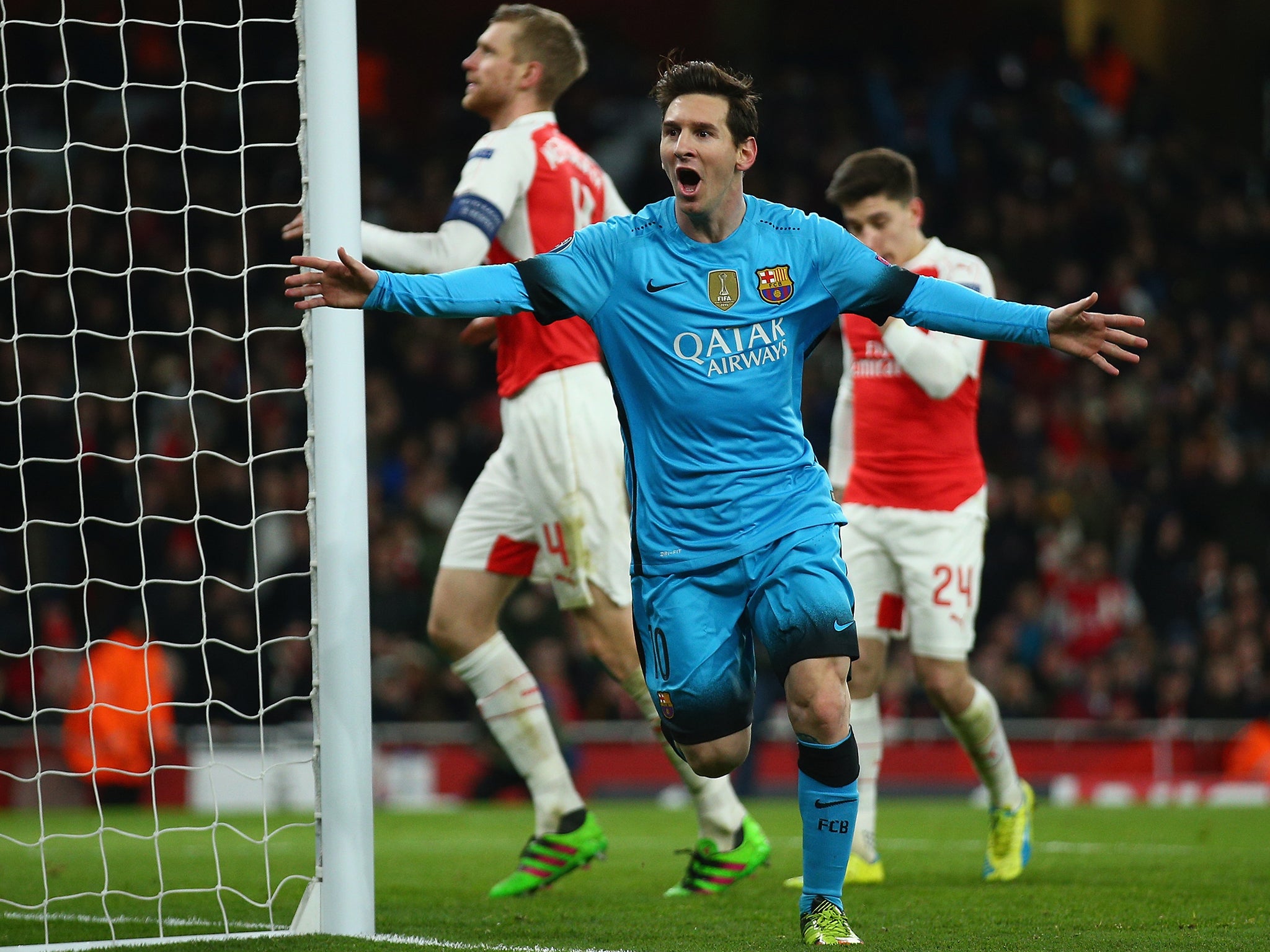 Lionel Messi celebrates against Arsenal during the first leg