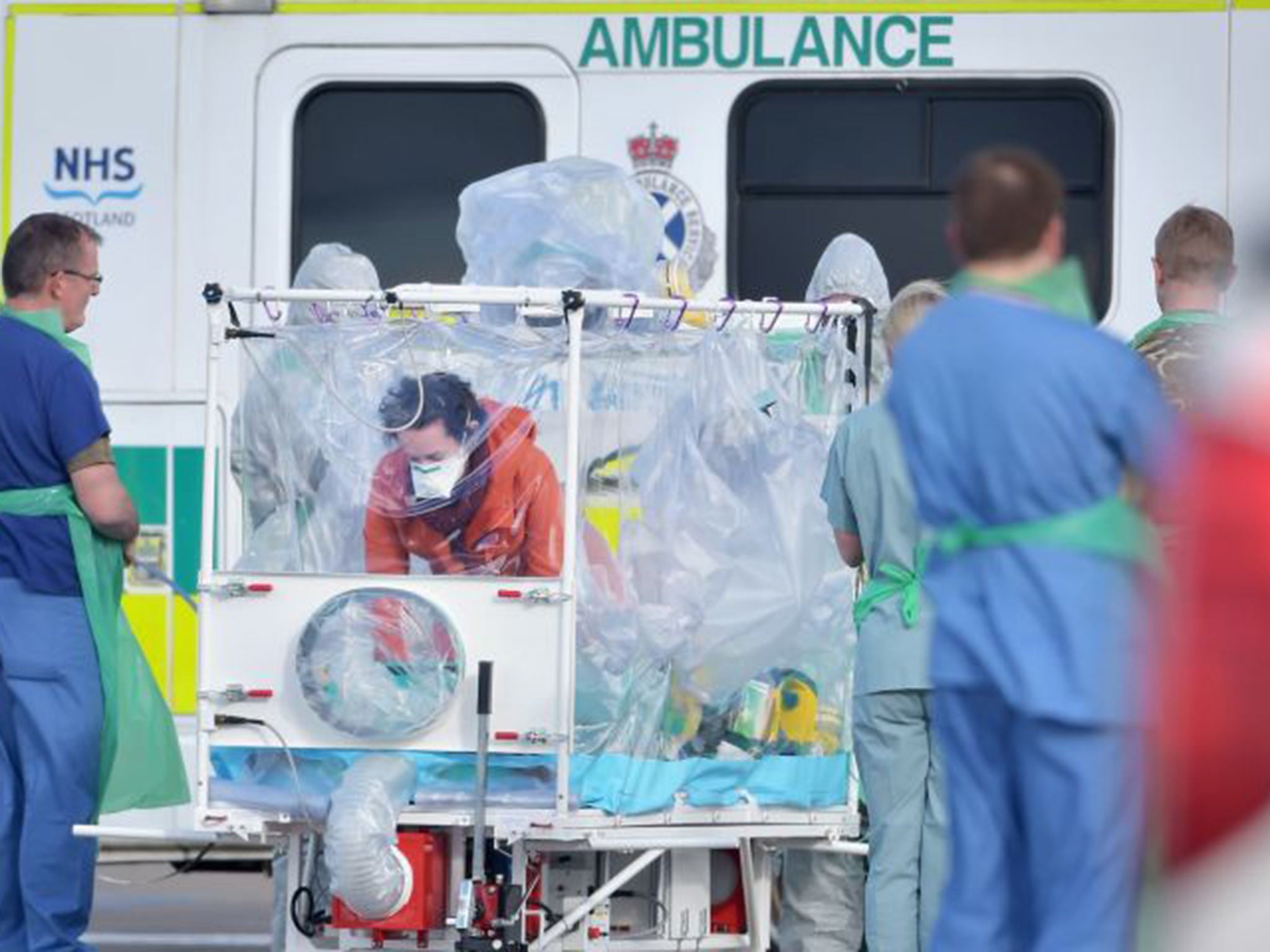 Pauline Cafferkey enters an isolation tent at Glasgow Airport yesterday