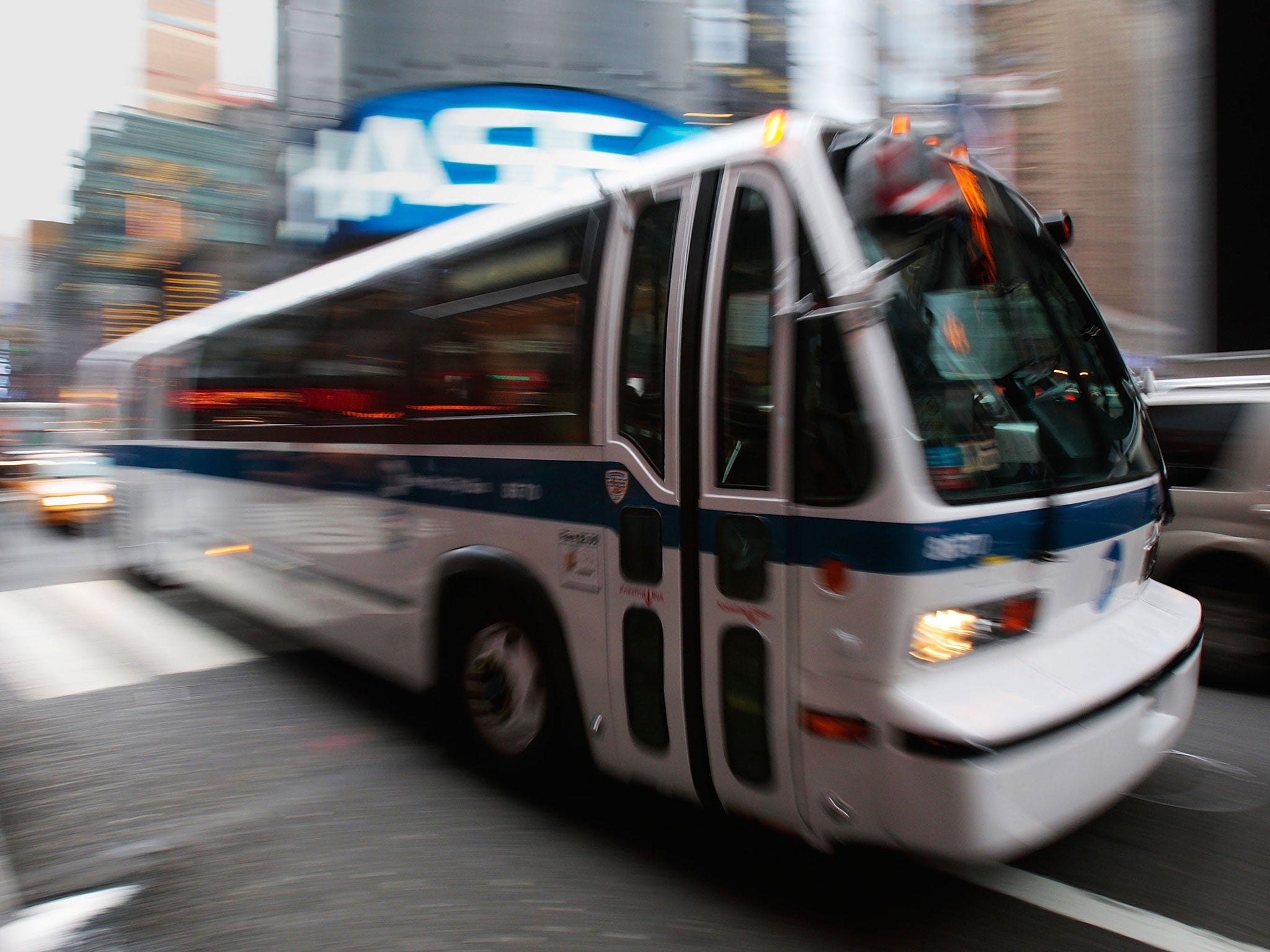 A New York City bus moves by in Times Square November 26, 2008 in New York City.