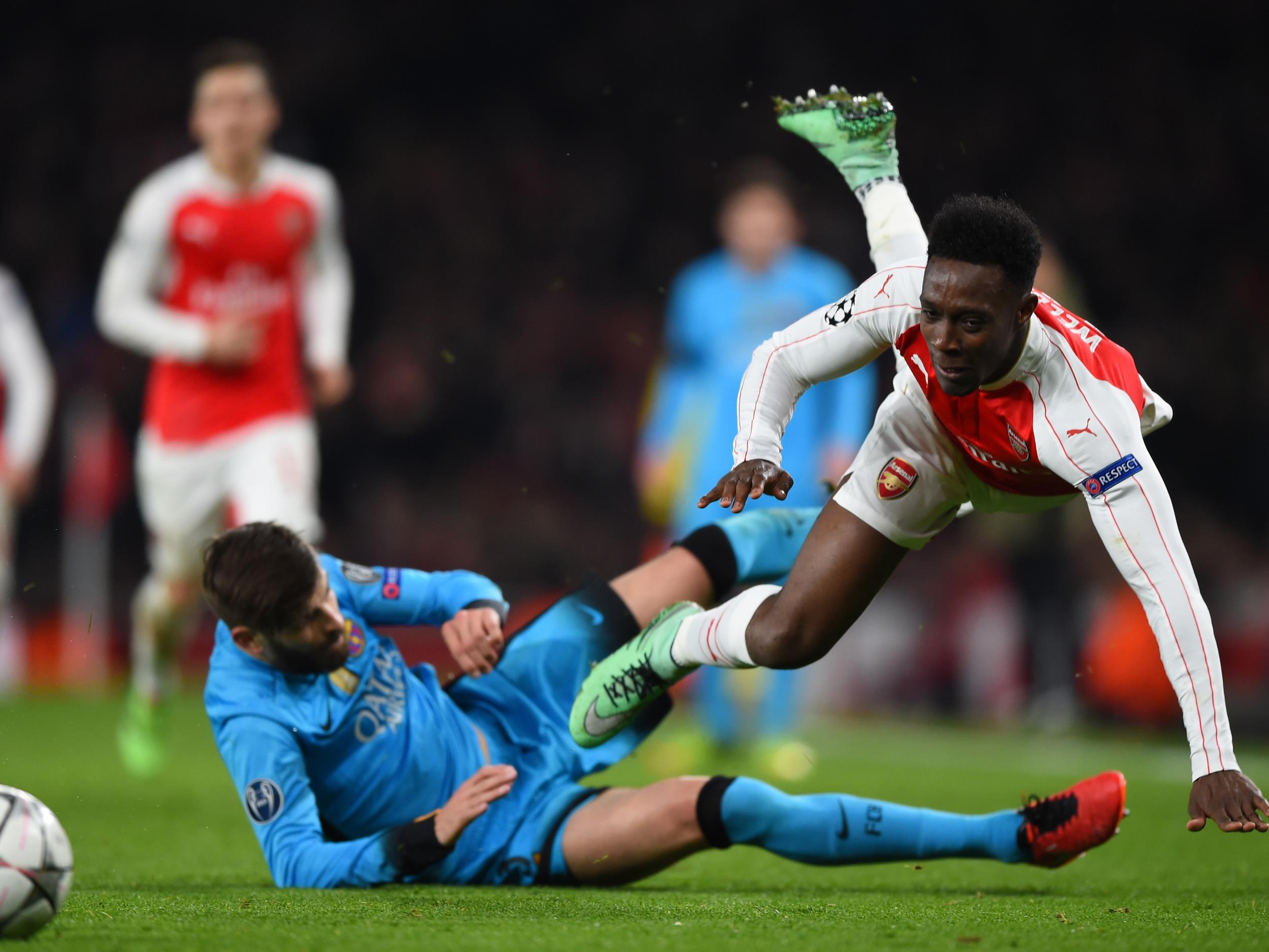 Gerard Pique challenges Danny Welbeck