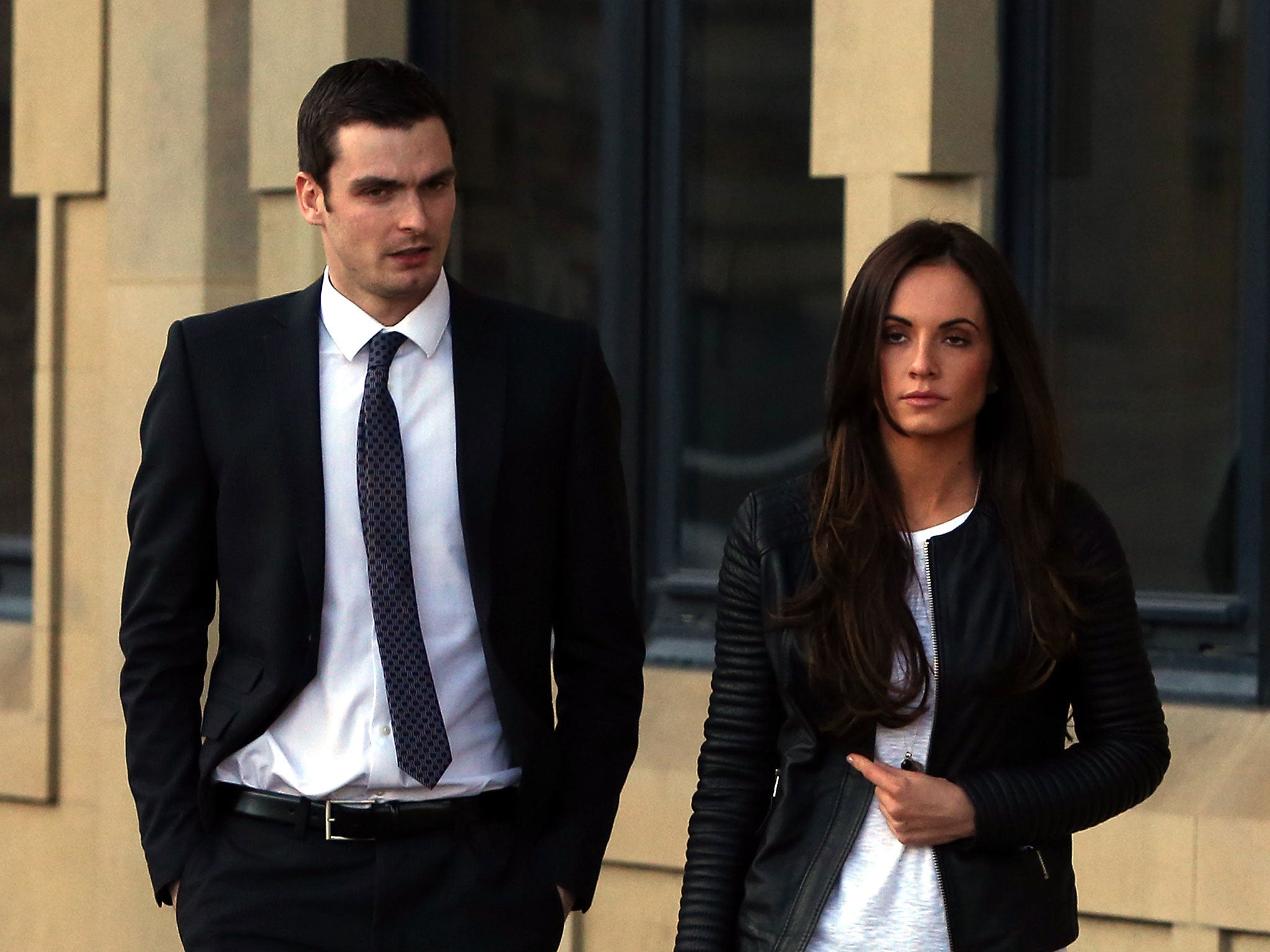 Adam Johnson with his former partner and mother of his child, Stacey Flounders, outside court