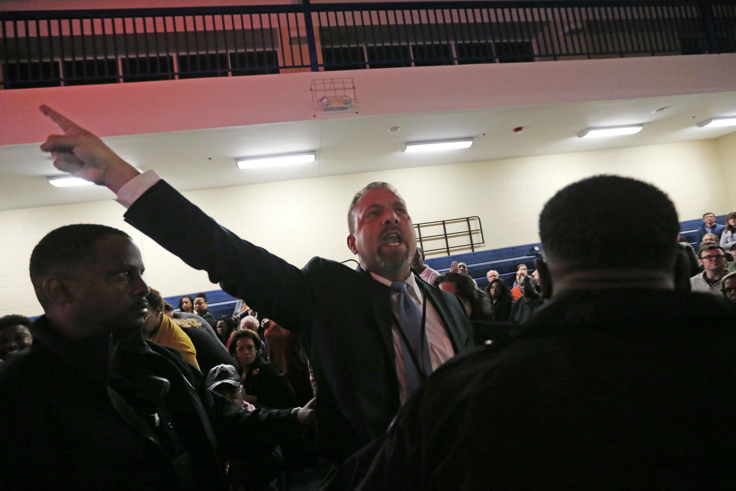 A protester was led away from Ms Clinton's final rally