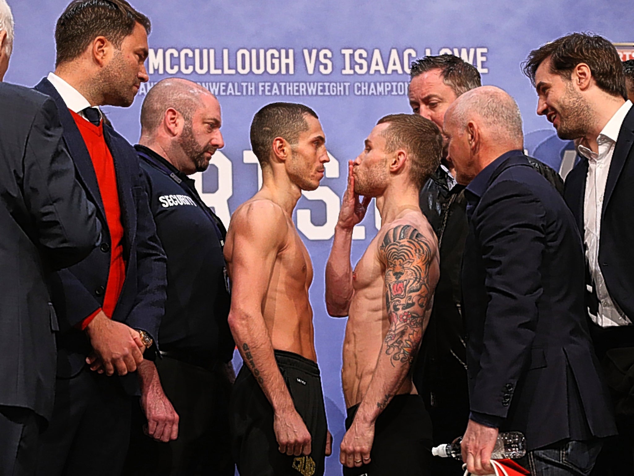 Carl Frampton (right) blows a kiss to Scott Quigg at Friday's weigh-in in Manchester