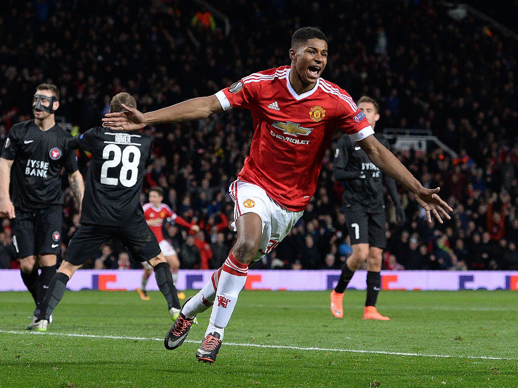 Manchester United's English striker Marcus Rashford celebrates scoring his team's third goal during the UEFA Europa League match between Manchester United and and FC Midtjylland.