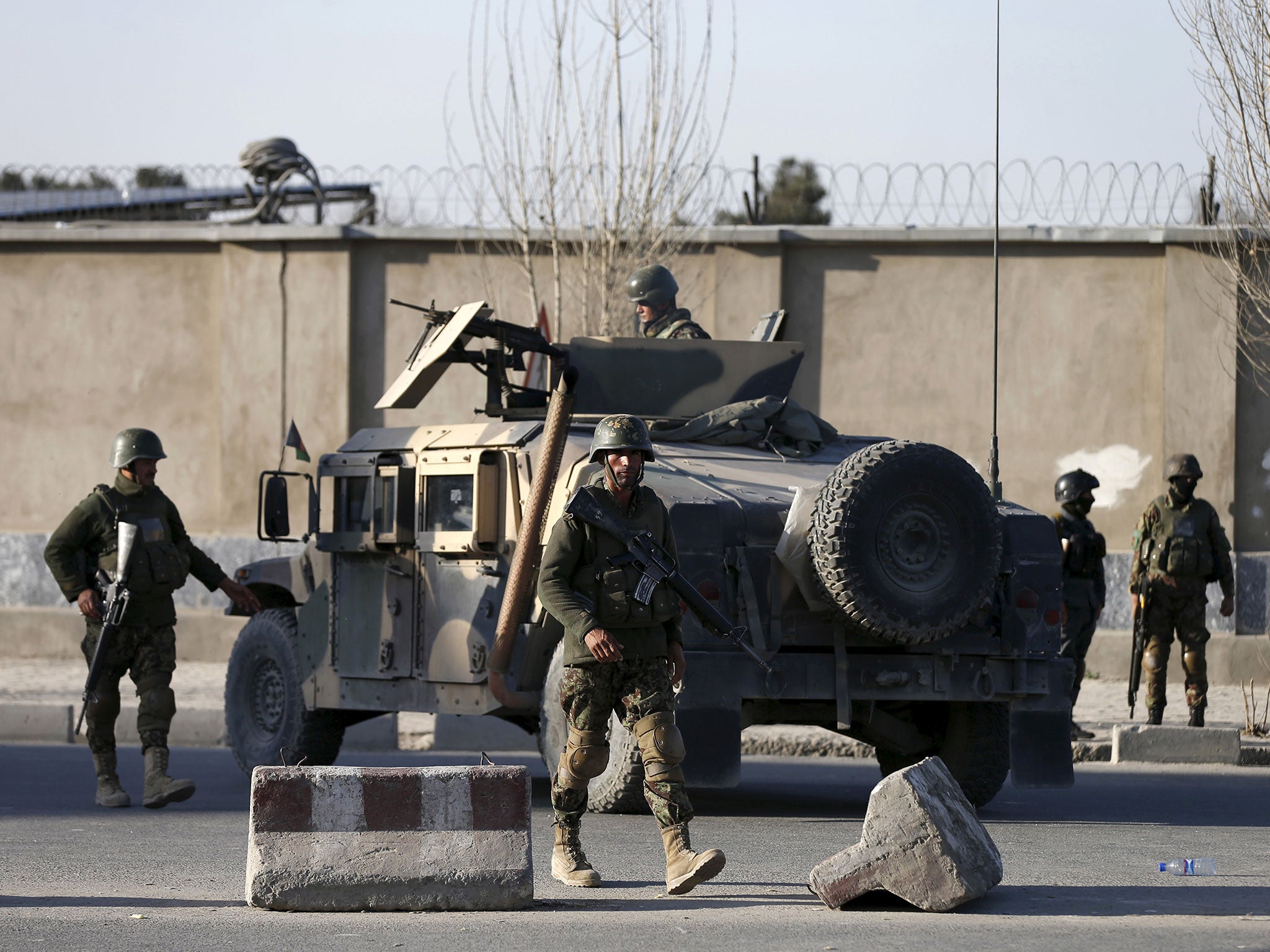 Afghan National Army soldiers arrive at the site of an attack in Kabul, Afghanistan, on 27 February, 2016