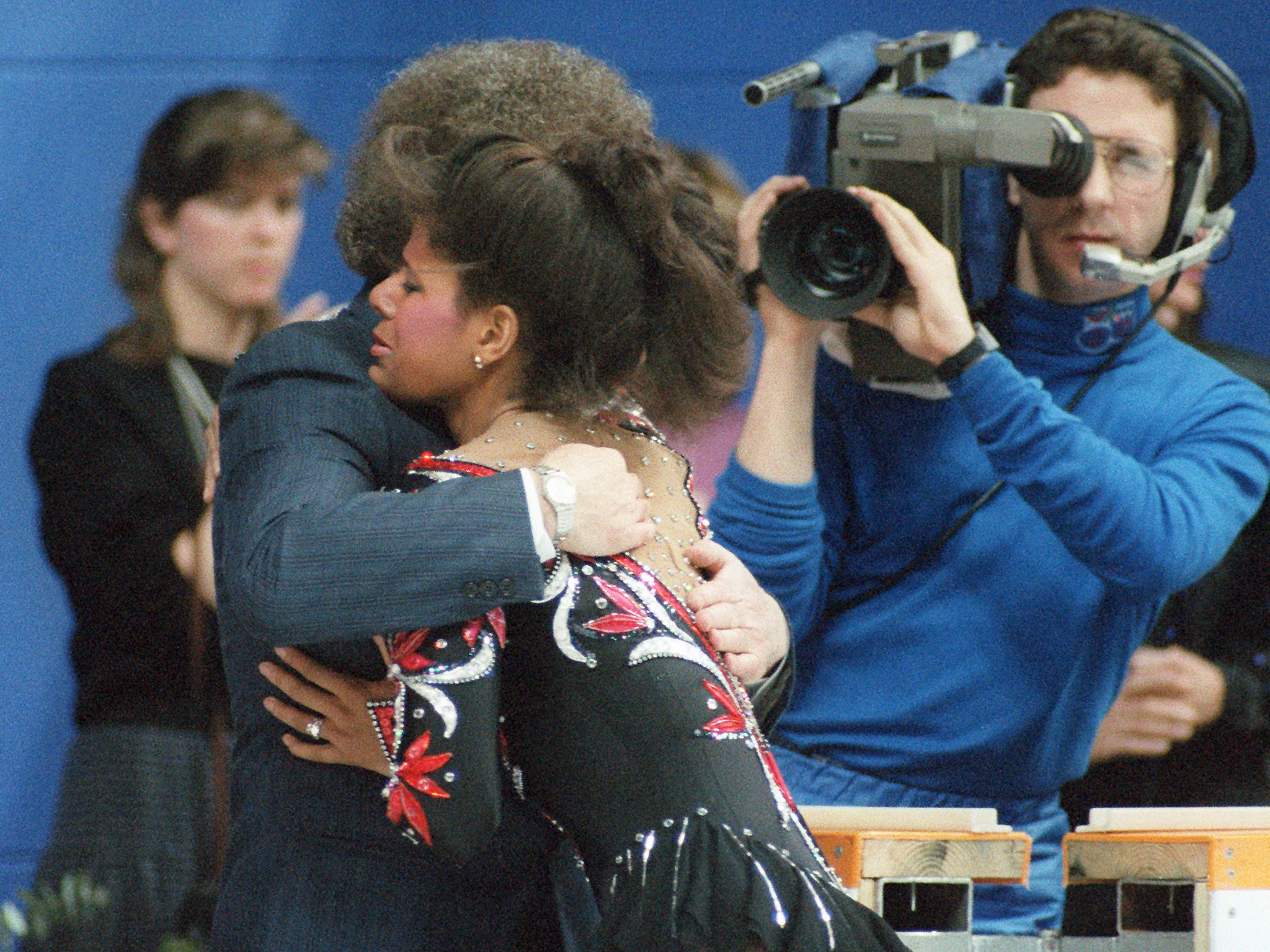 Debi Thomas cries on the shoulder of her coach, Alex McGowan, in 1988 after her performance in the free skating competition at the Calgary Winter Games