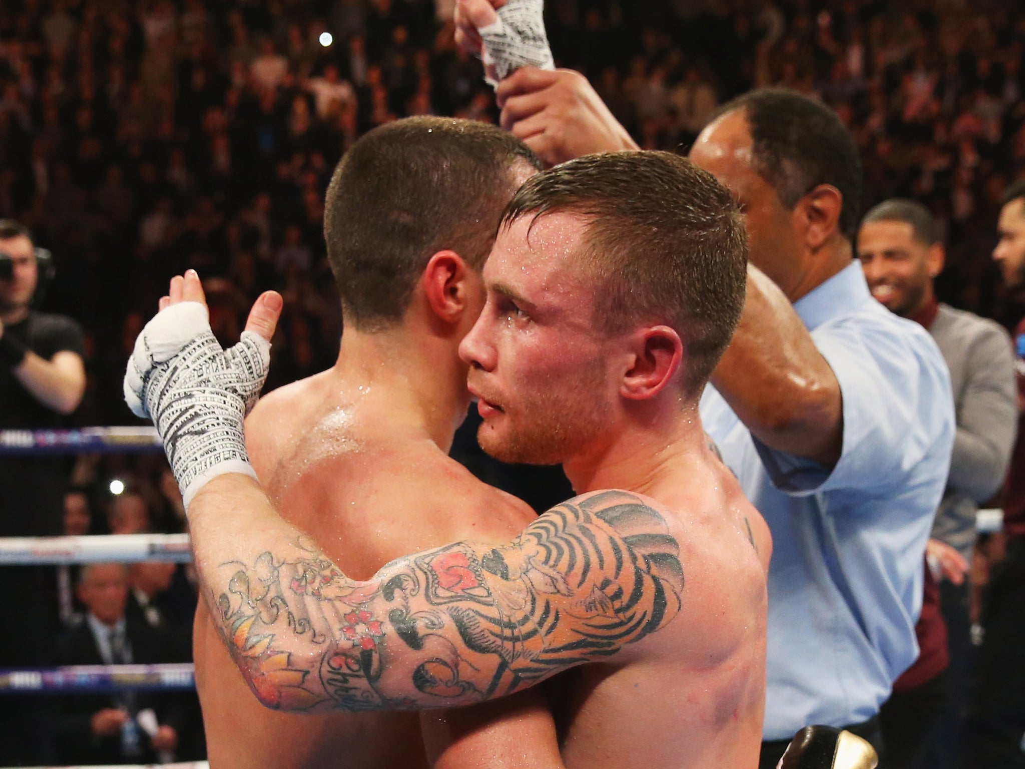 The fighters embrace after Frampton's name was announced as the winner