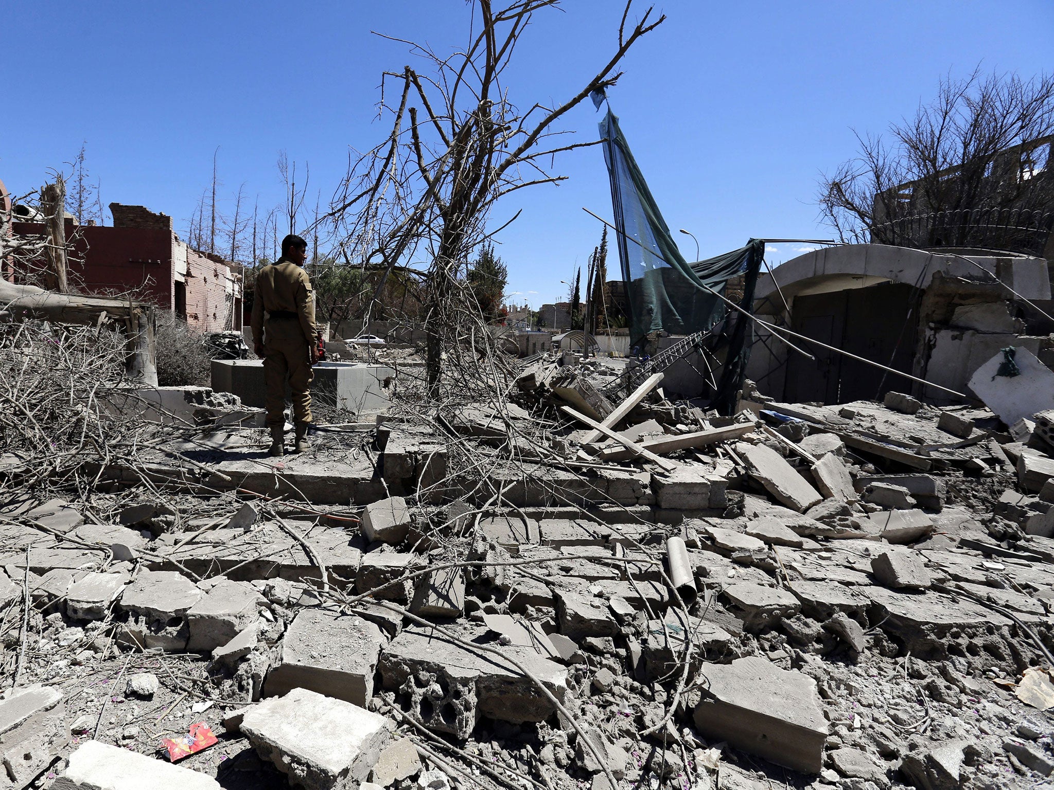 A Yemeni inspects the damage following a Saudi-led airstrike targeting a neighborhood in Sana'a, Yemen, 27 February 2016.