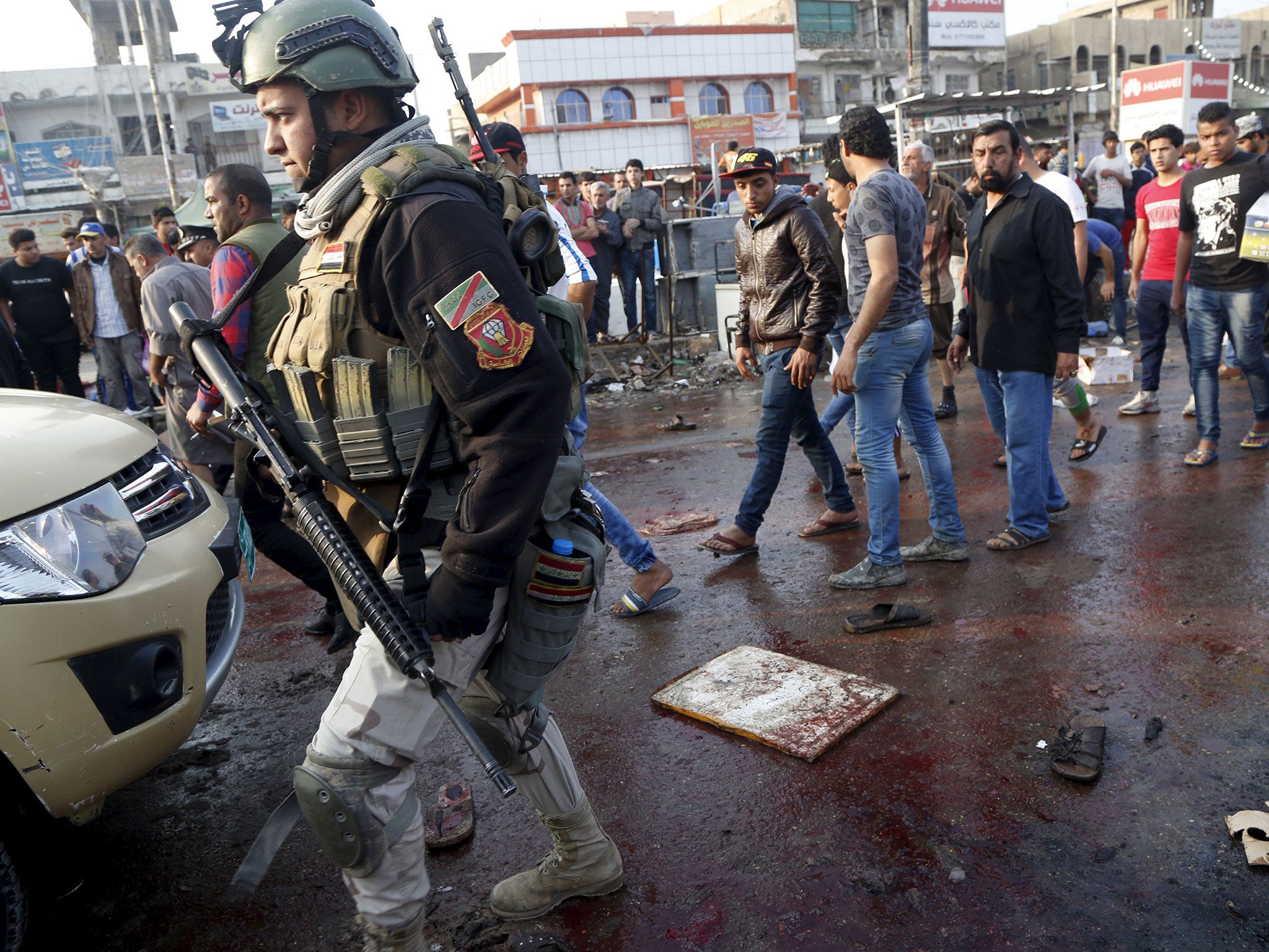 The site of suicide blasts in Baghdad’s Sadr City yesterday, where two bombs exploded in a mobile phone market in an overwhelmingly Shia district, killing 31 people