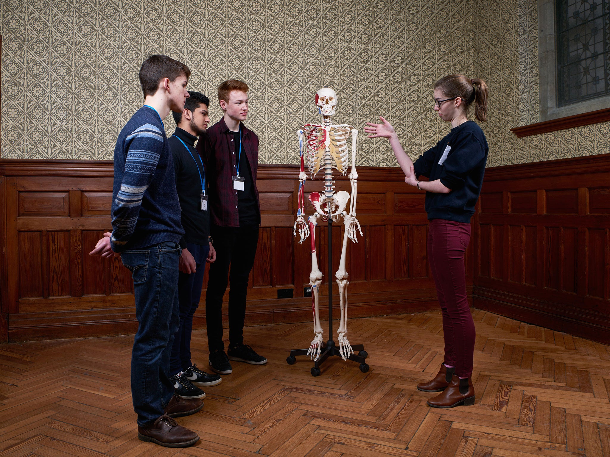 Medical student Rachel Fox talks to pupils at Gonville and Caius College