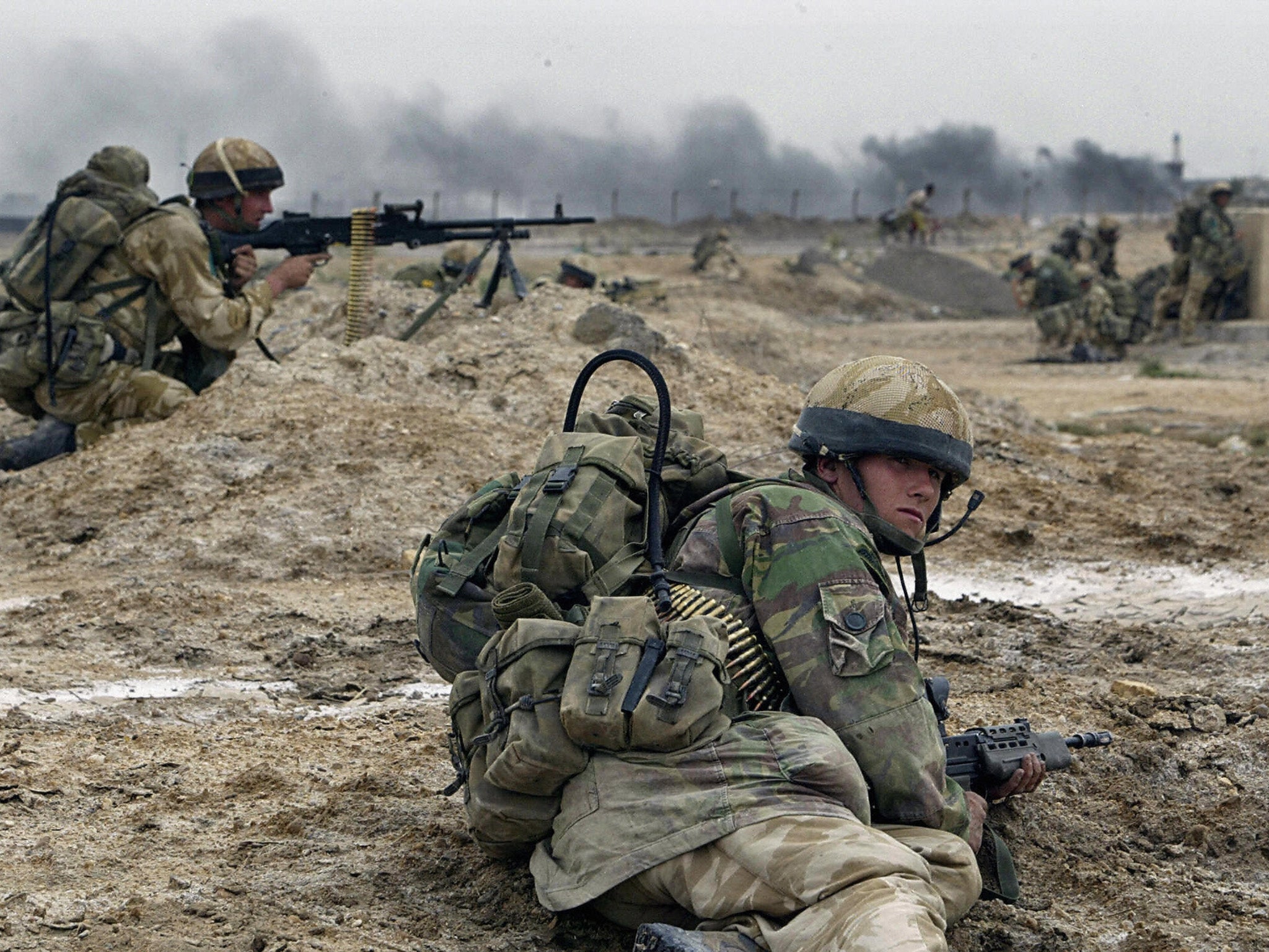 British soldiers take cover in Basra in southern Iraq in 2003